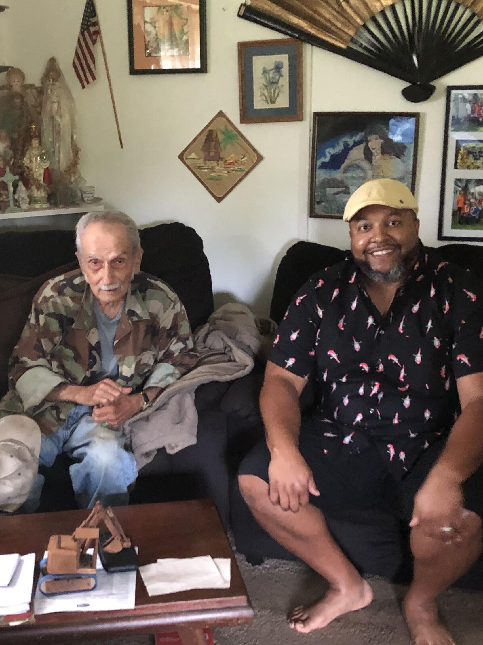 Two men sitting on a couch