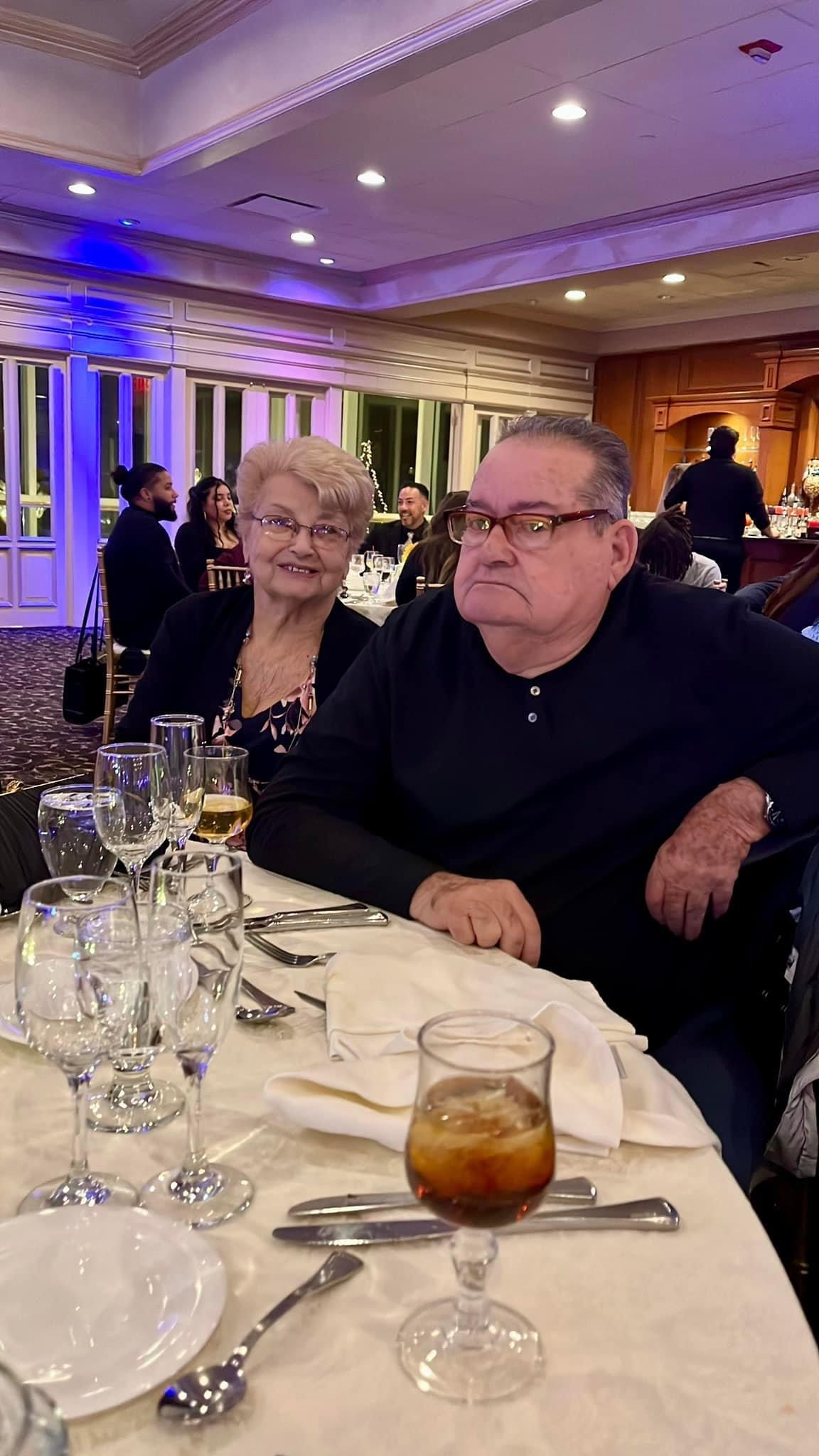 A man and woman sitting at a table