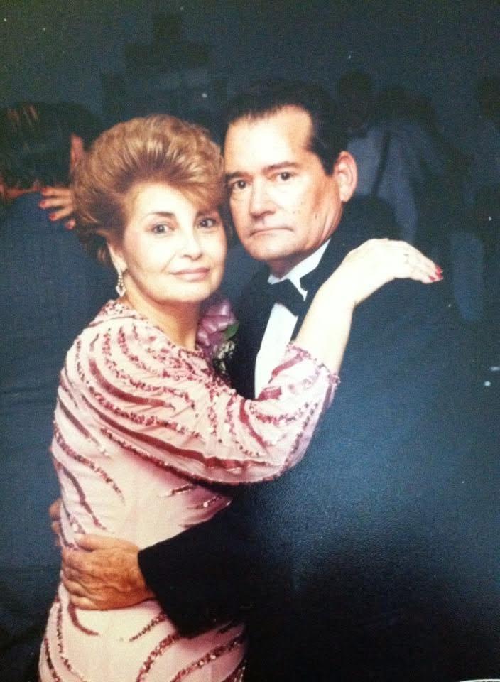 A man and woman posing for a picture