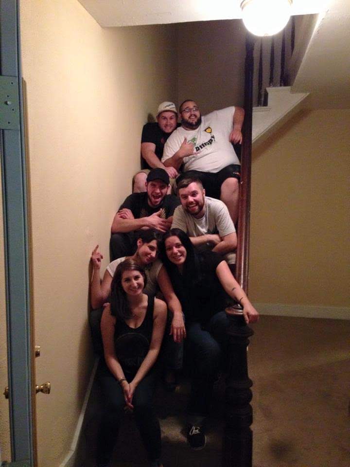 A group of people sitting on a staircase