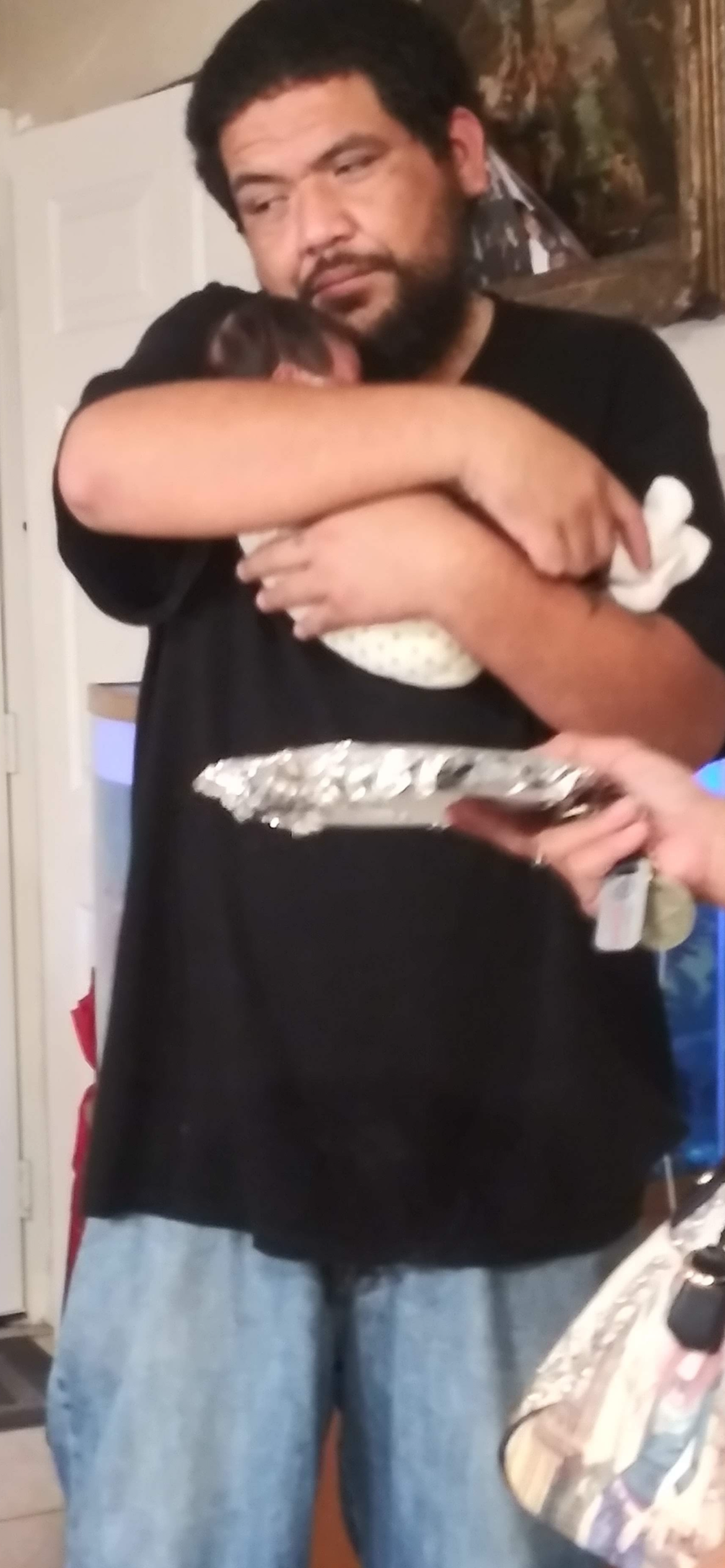 A person holding a silver object