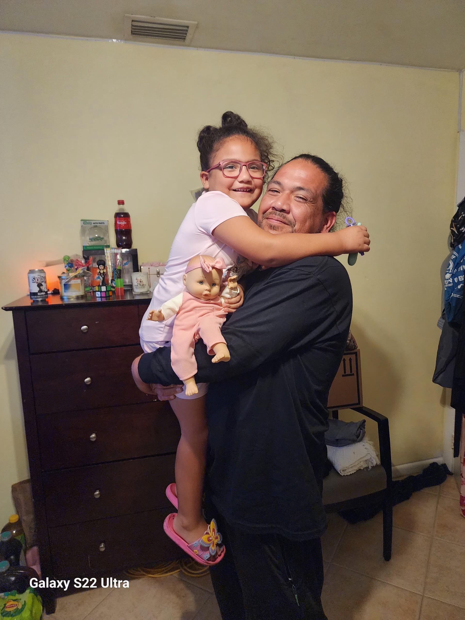 A man holding a girl