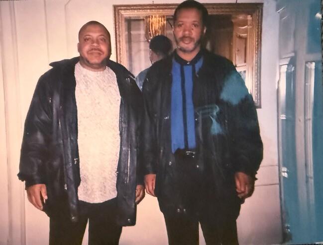 Two men standing in a room