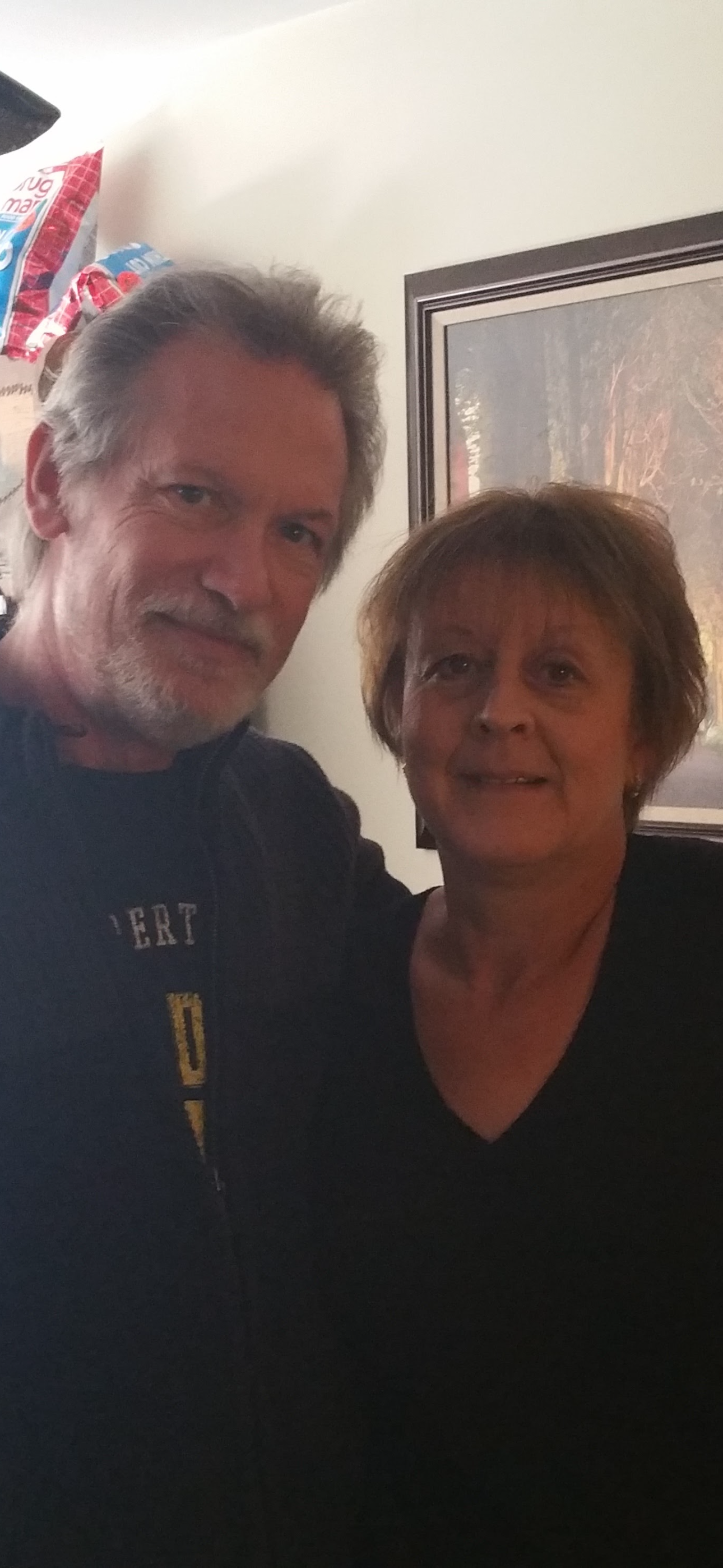 A man and woman posing for a picture