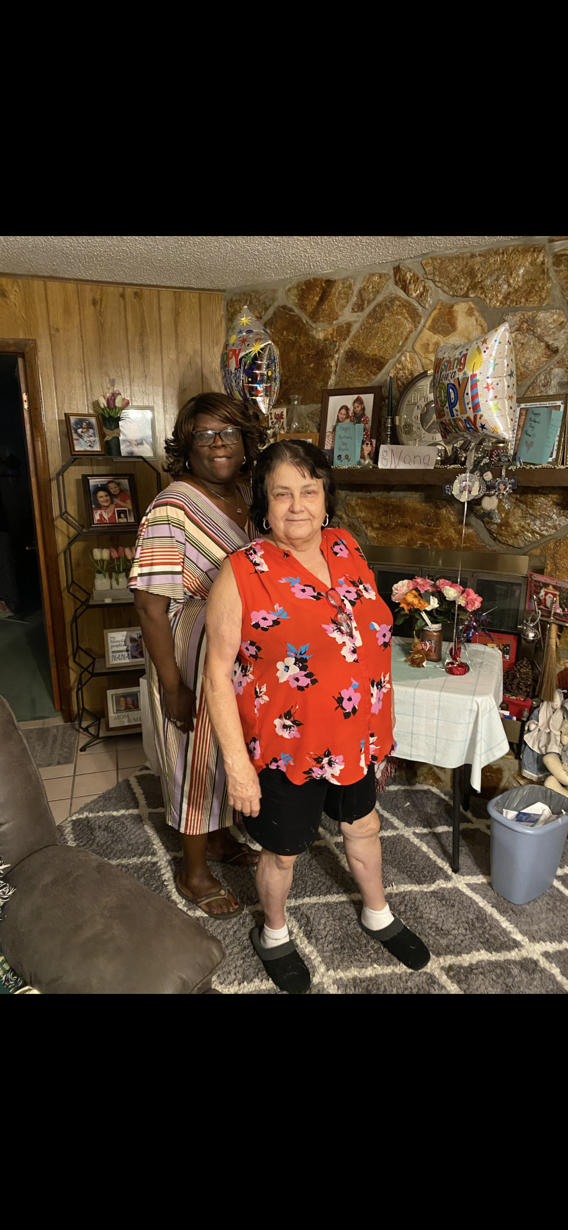 Two women standing in a room