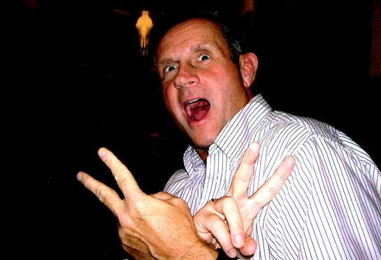 A man making a peace sign with his fingers