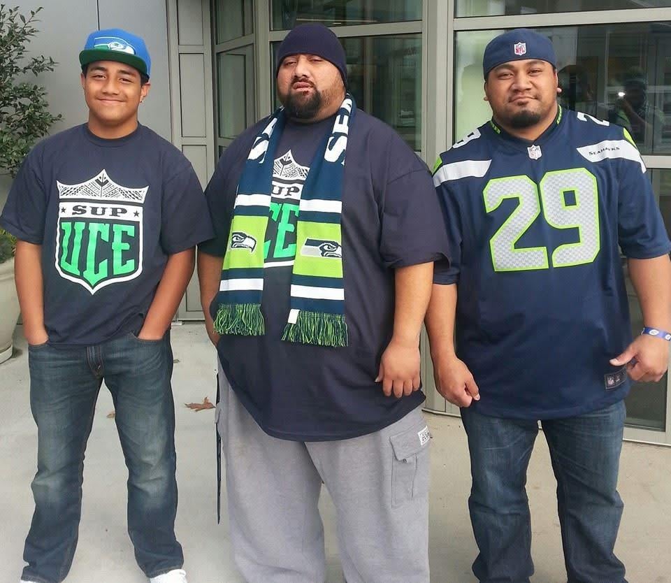 A group of men wearing football jerseys