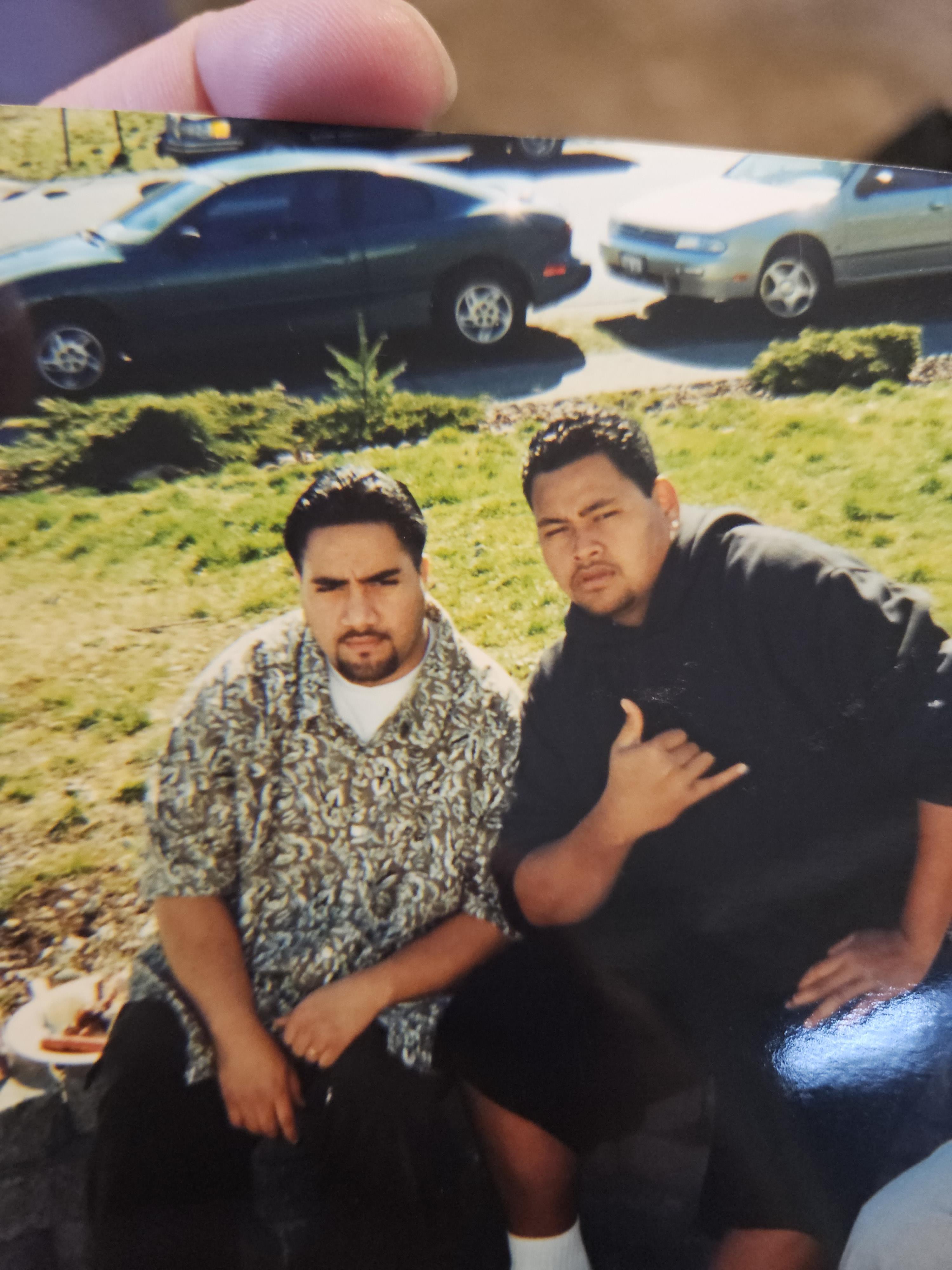 Two men sitting on a bench