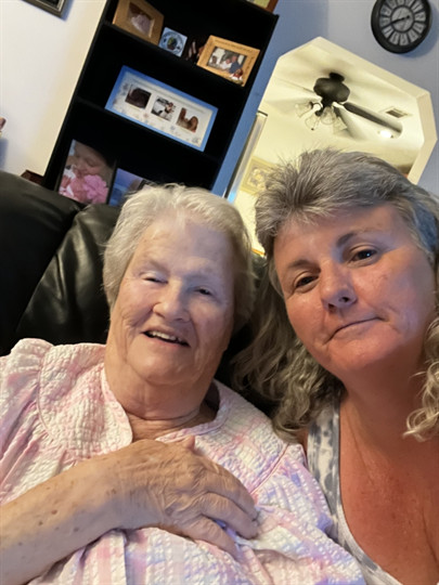 Two women sitting on a couch