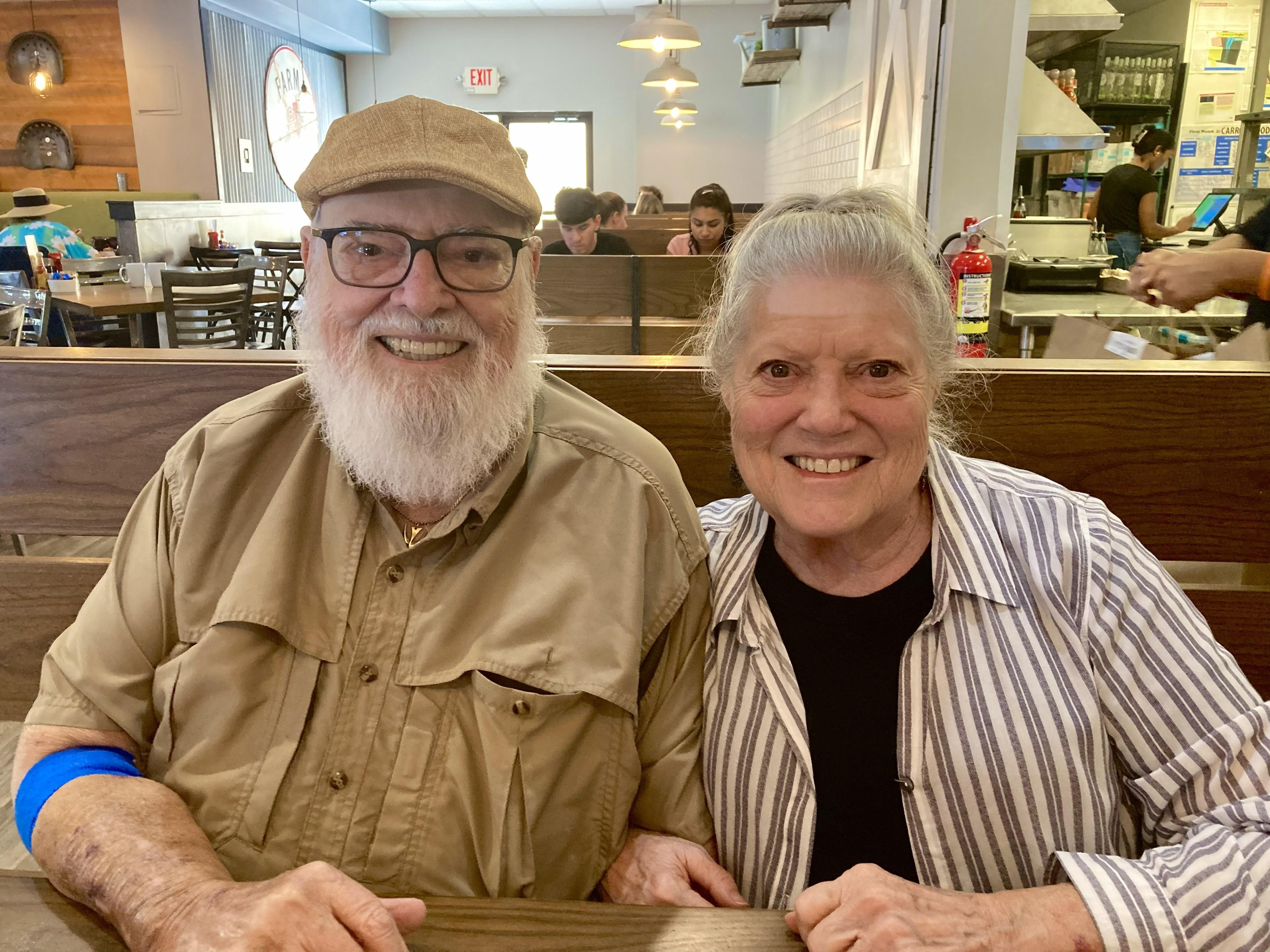 A man and woman sitting at a table