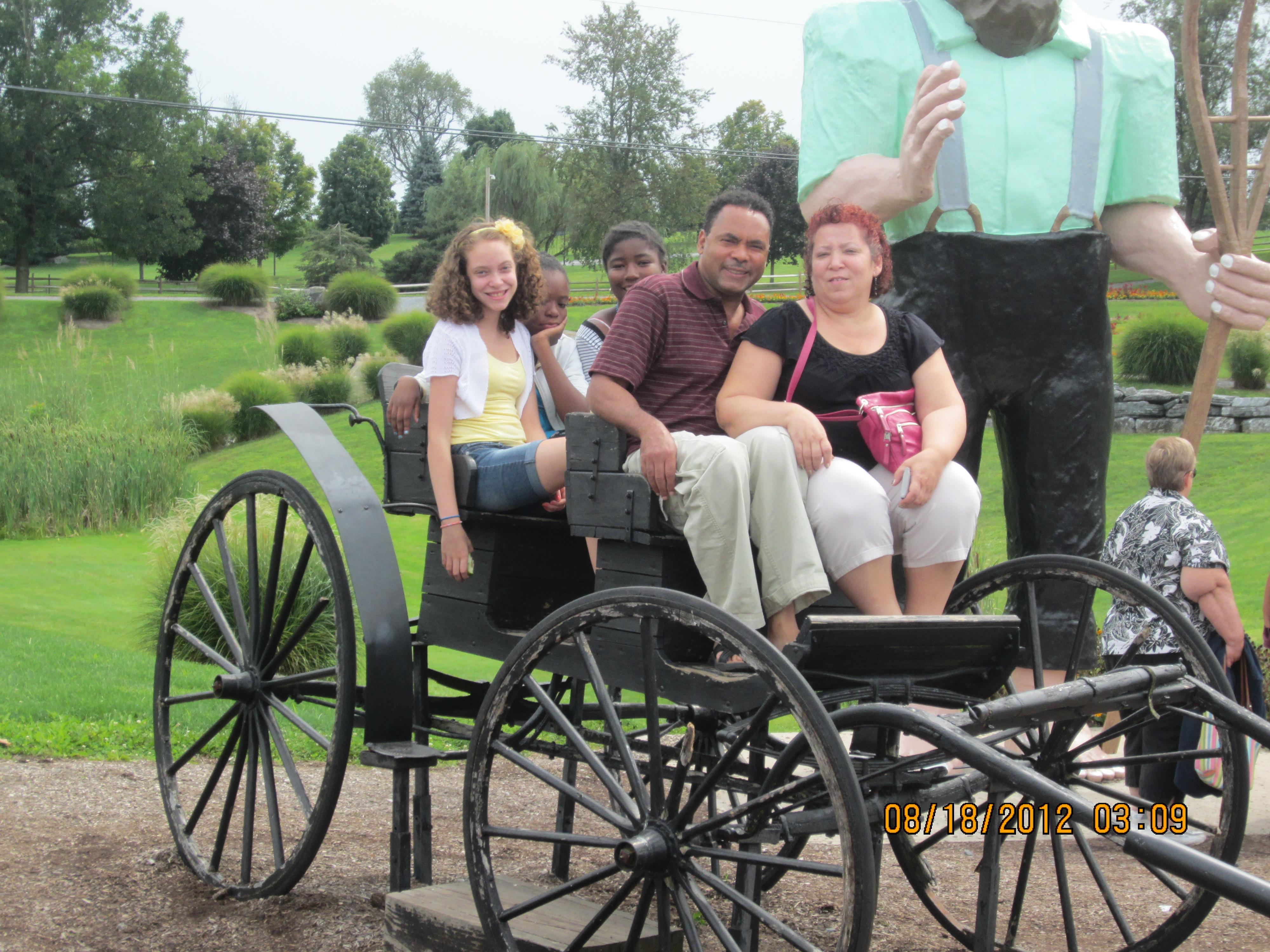 A group of people sitting in a carriage