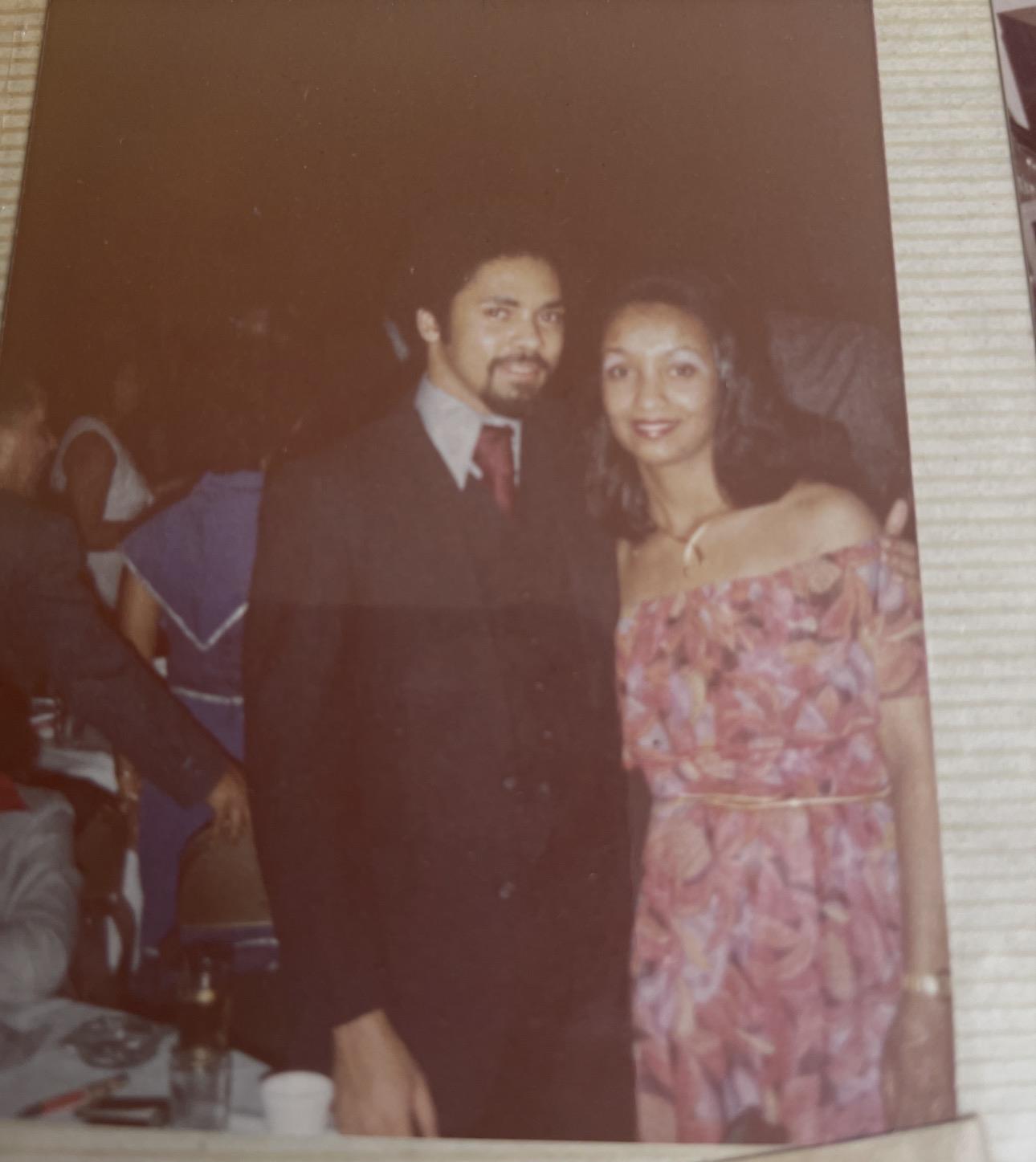 A man and woman posing for a picture