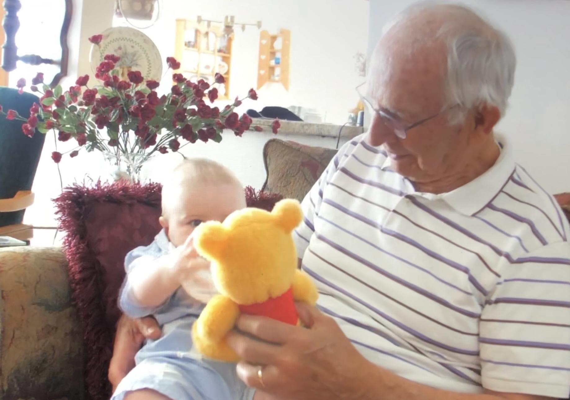 A man holding a stuffed animal