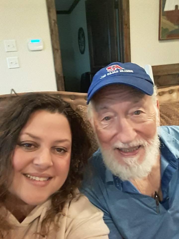 A man and woman taking a selfie