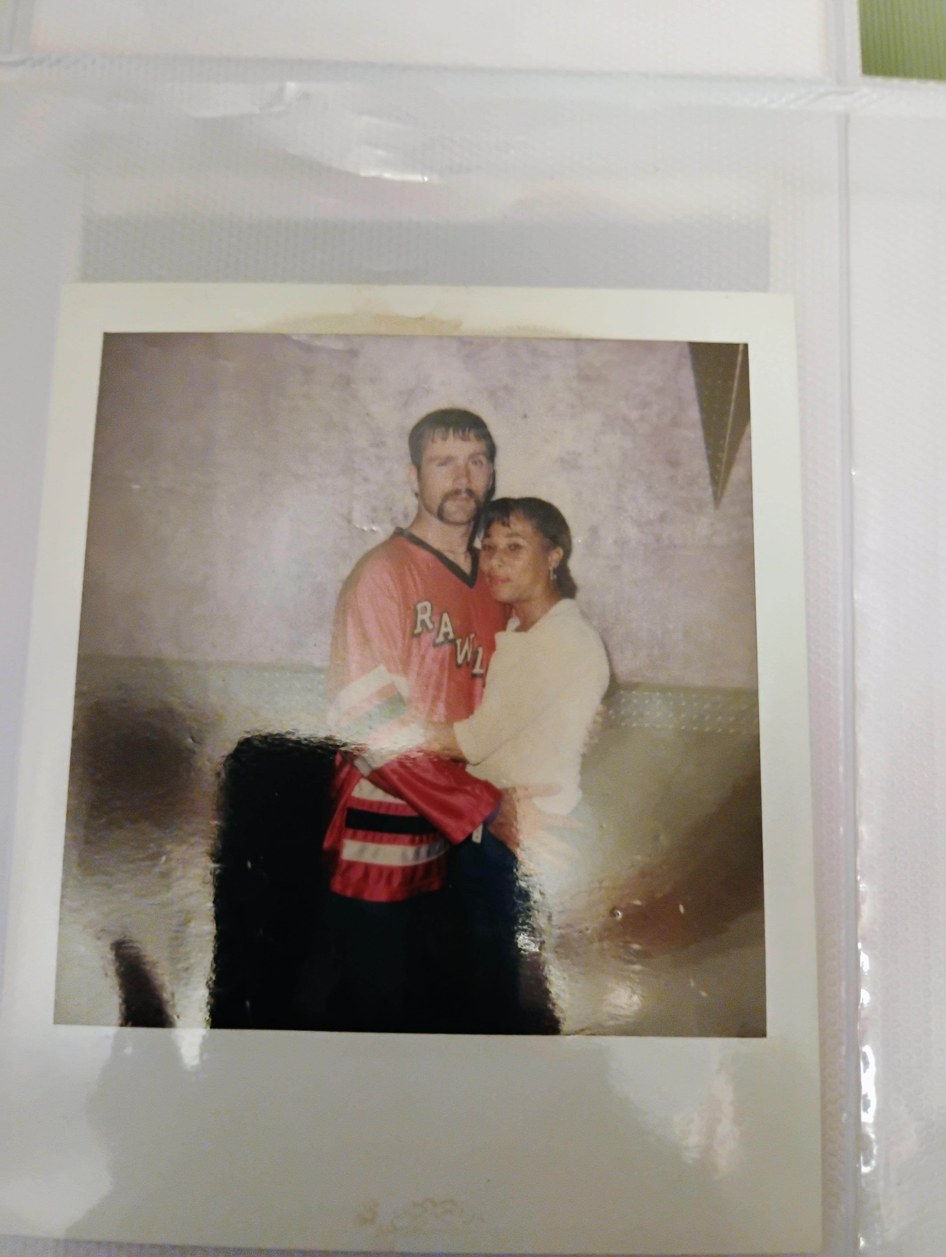 A man and woman posing for a picture
