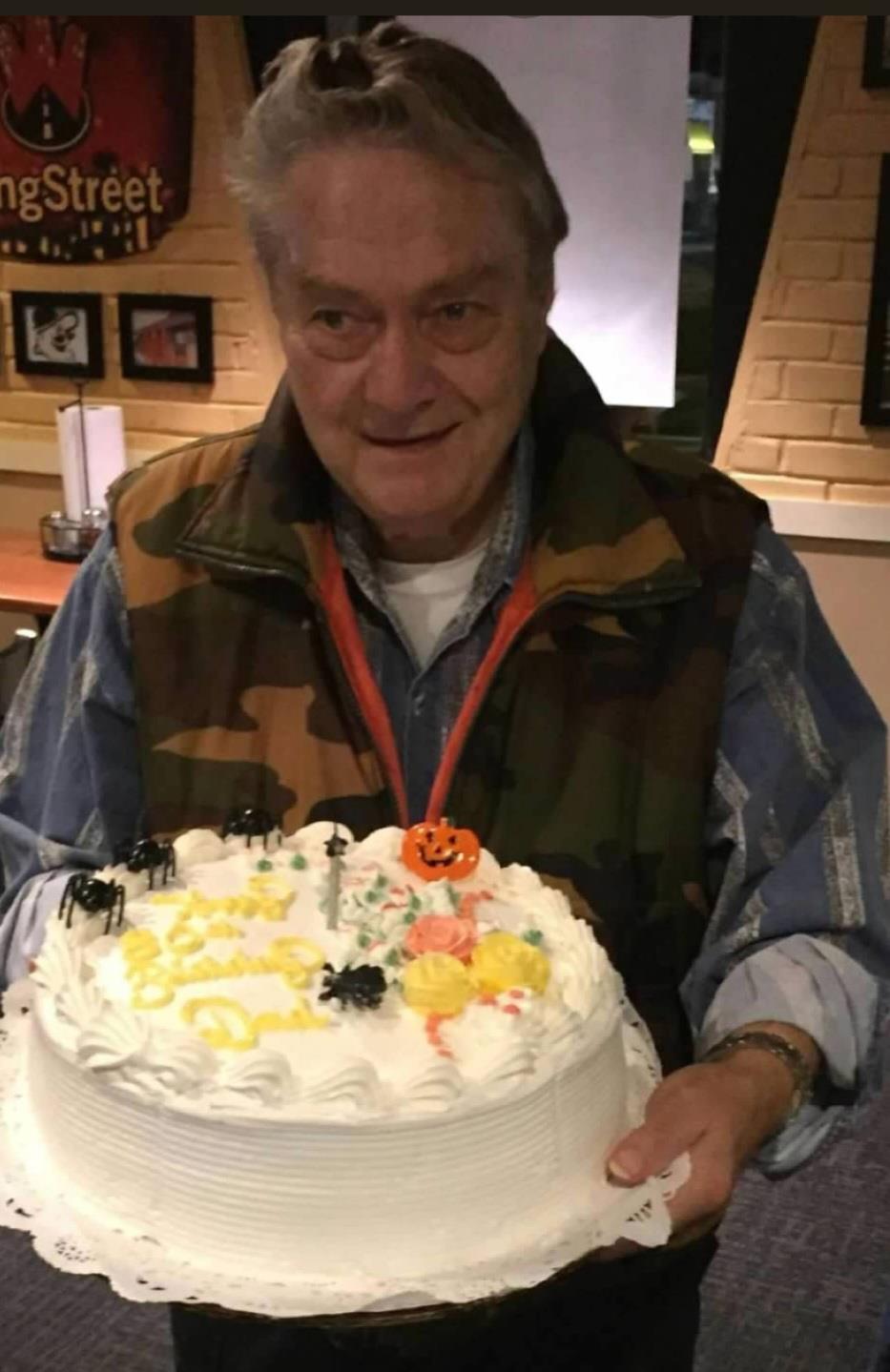 A man holding a cake