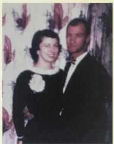 A man and woman posing for a picture