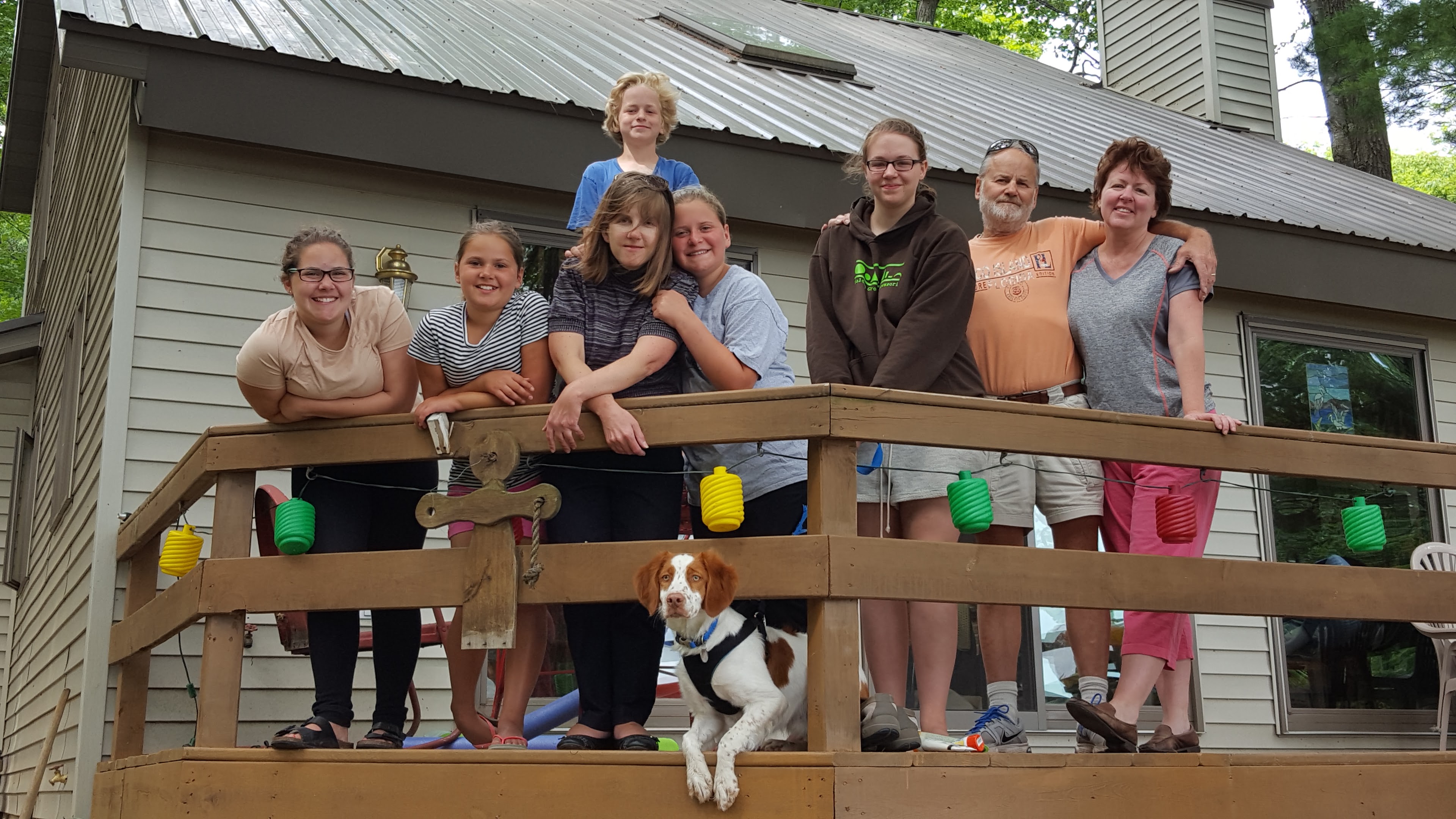 A group of people standing on a deck