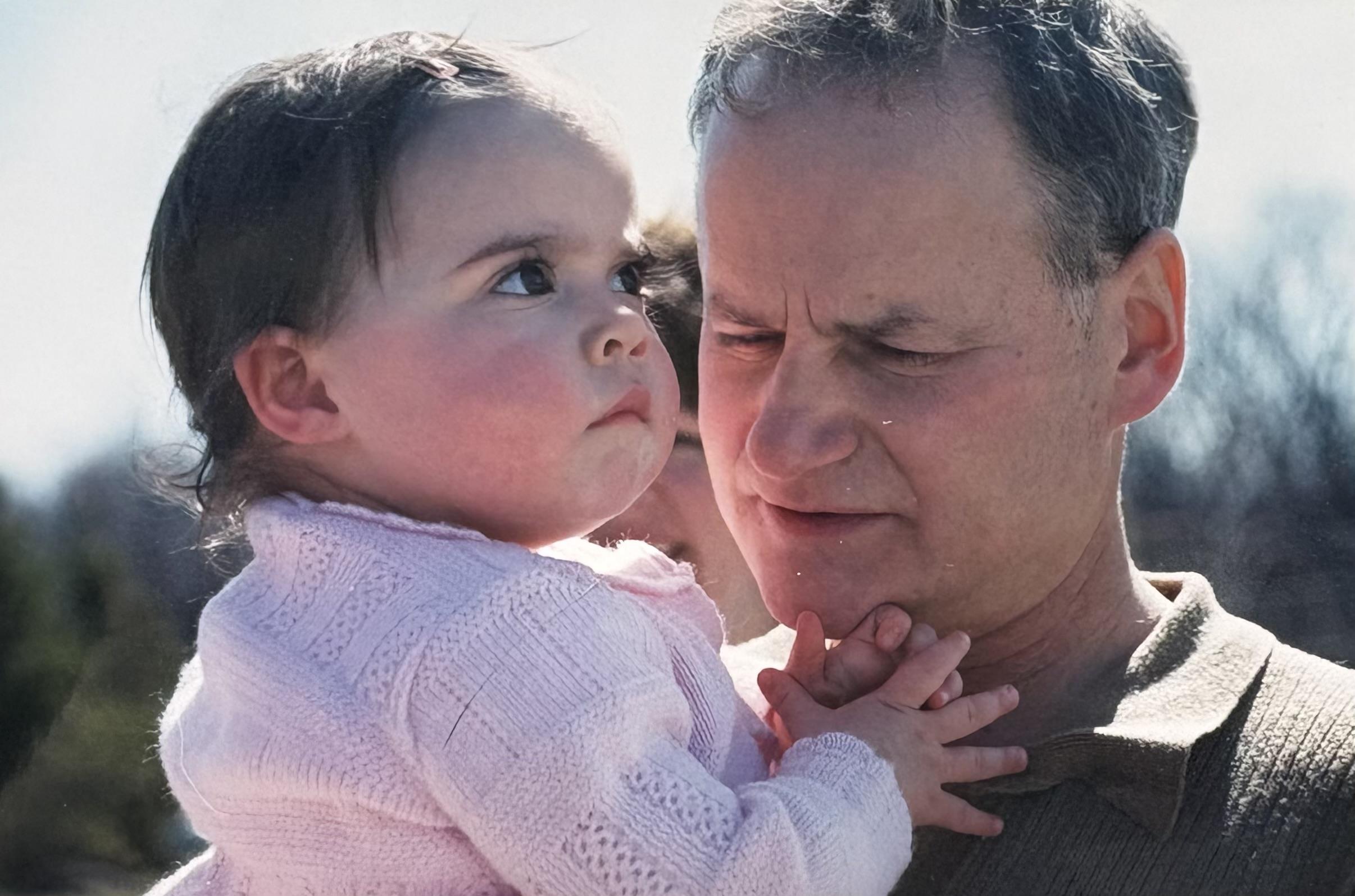 A man holding a baby