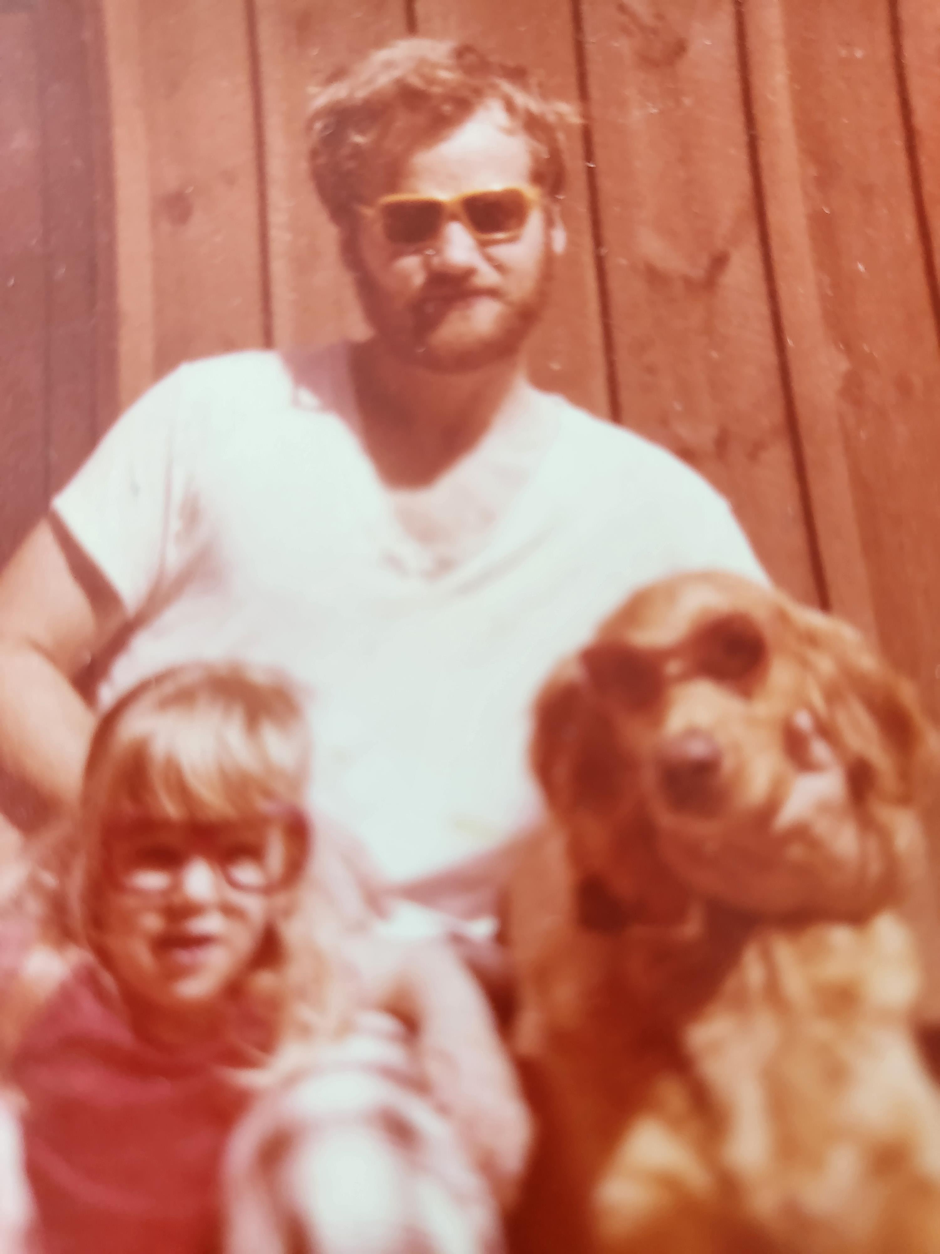 A man and a girl with a dog