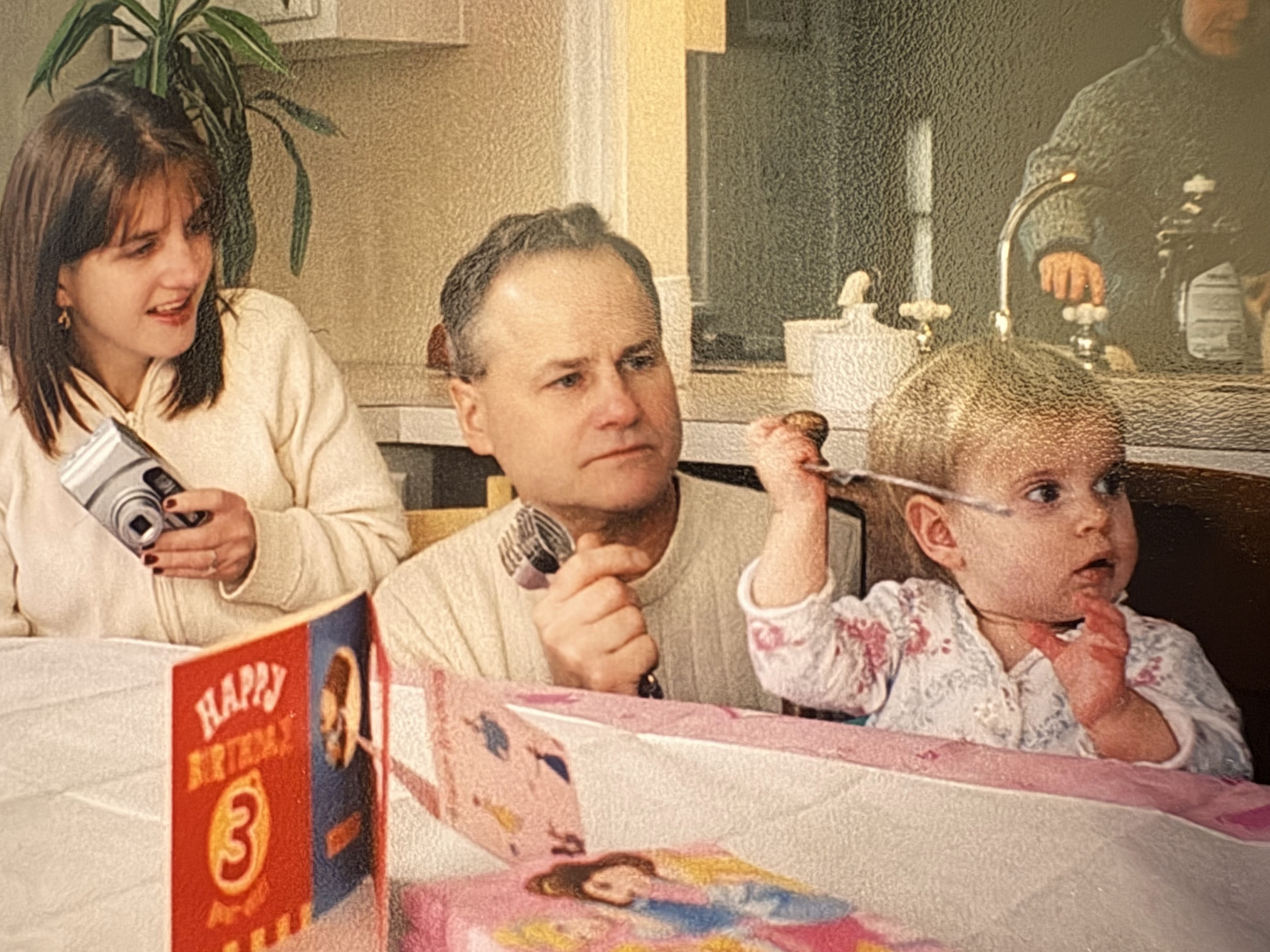 A man and woman with a baby