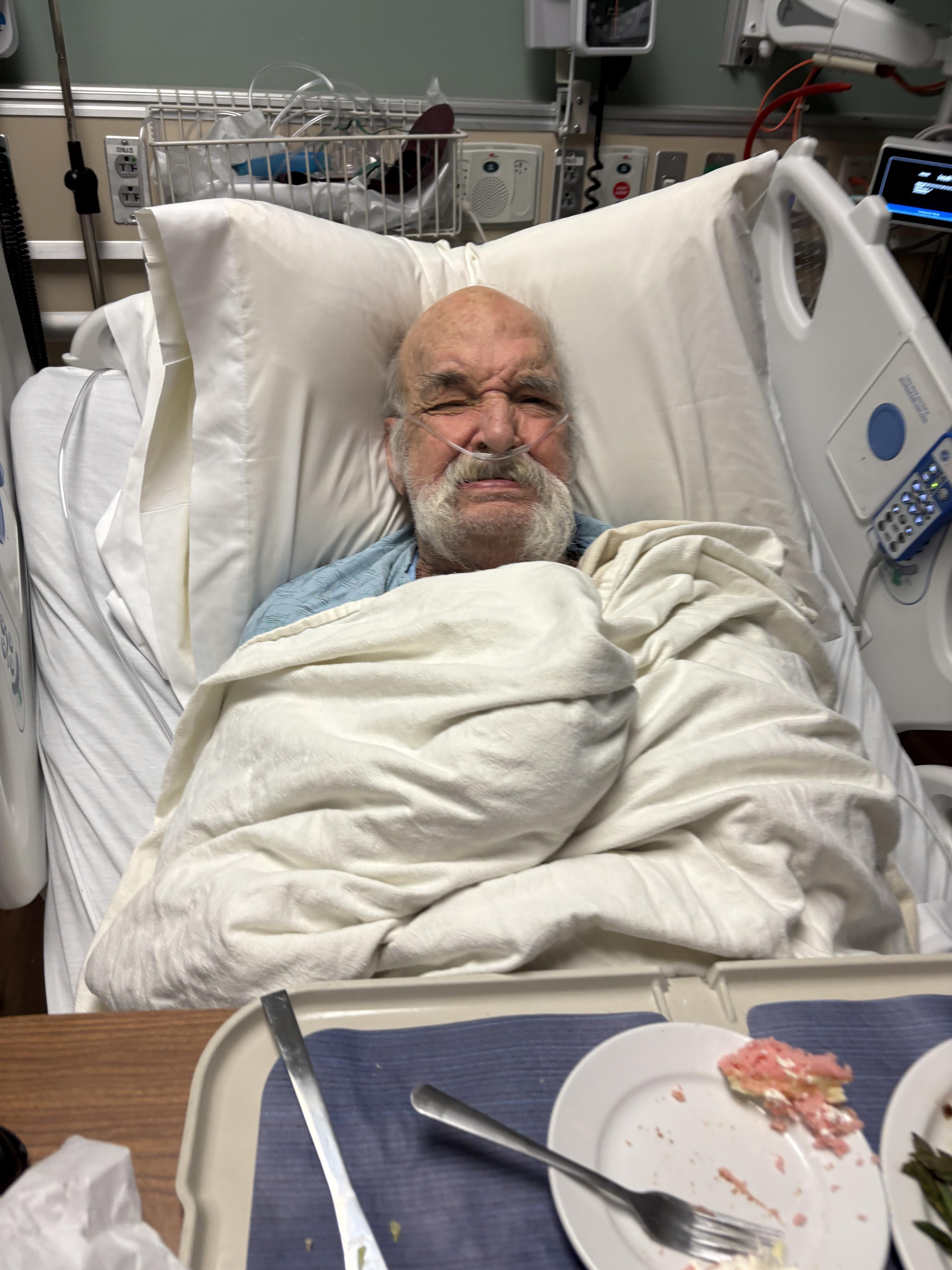 A man lying in a hospital bed