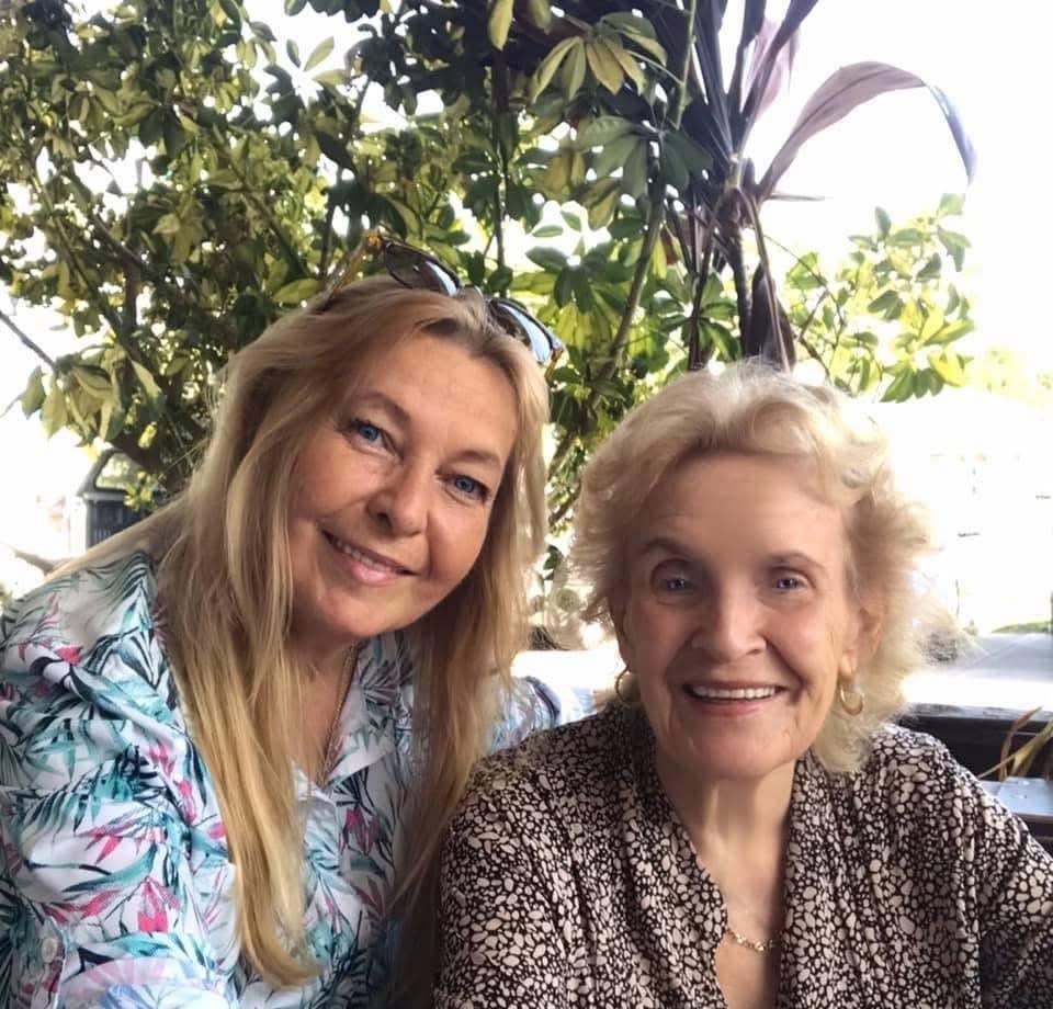 Two women smiling at the camera