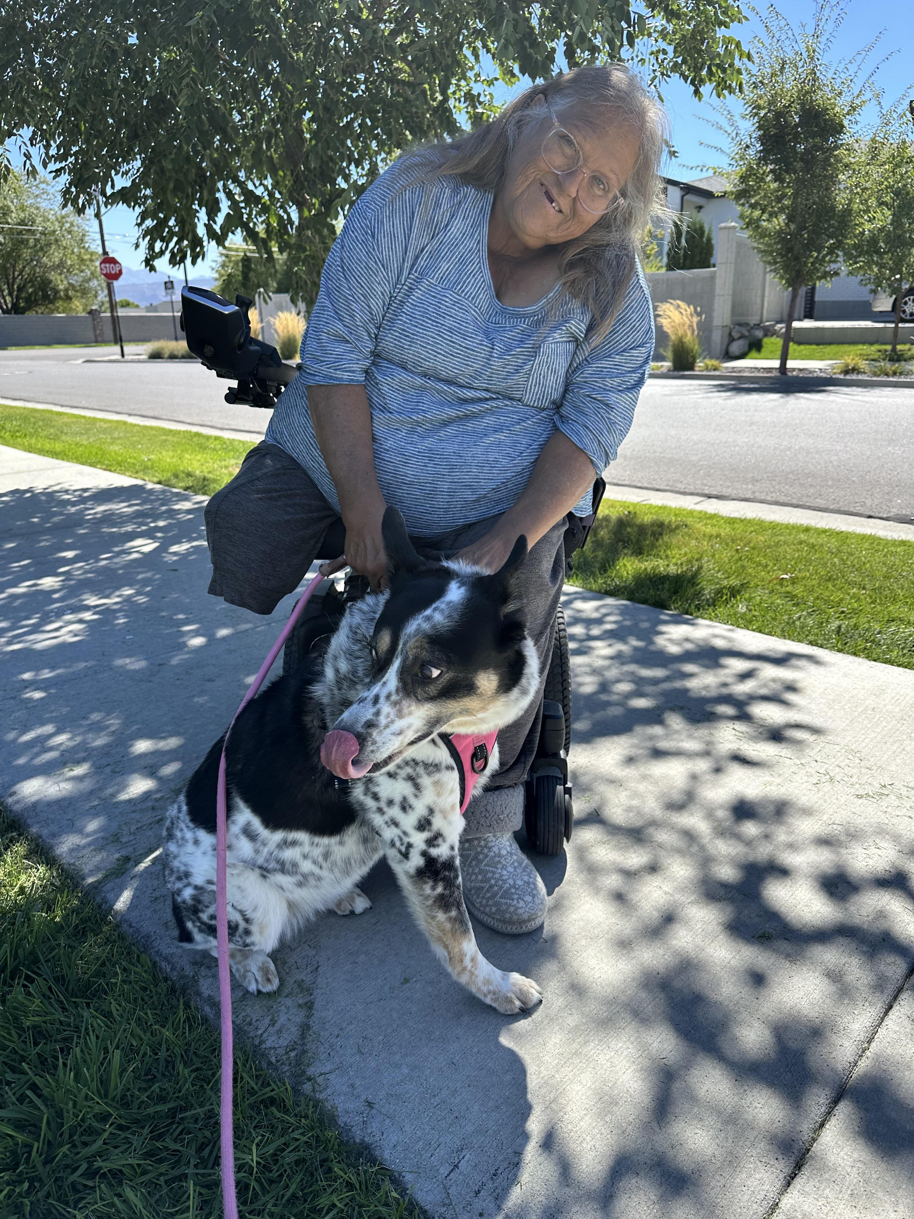 A woman sitting on a dog