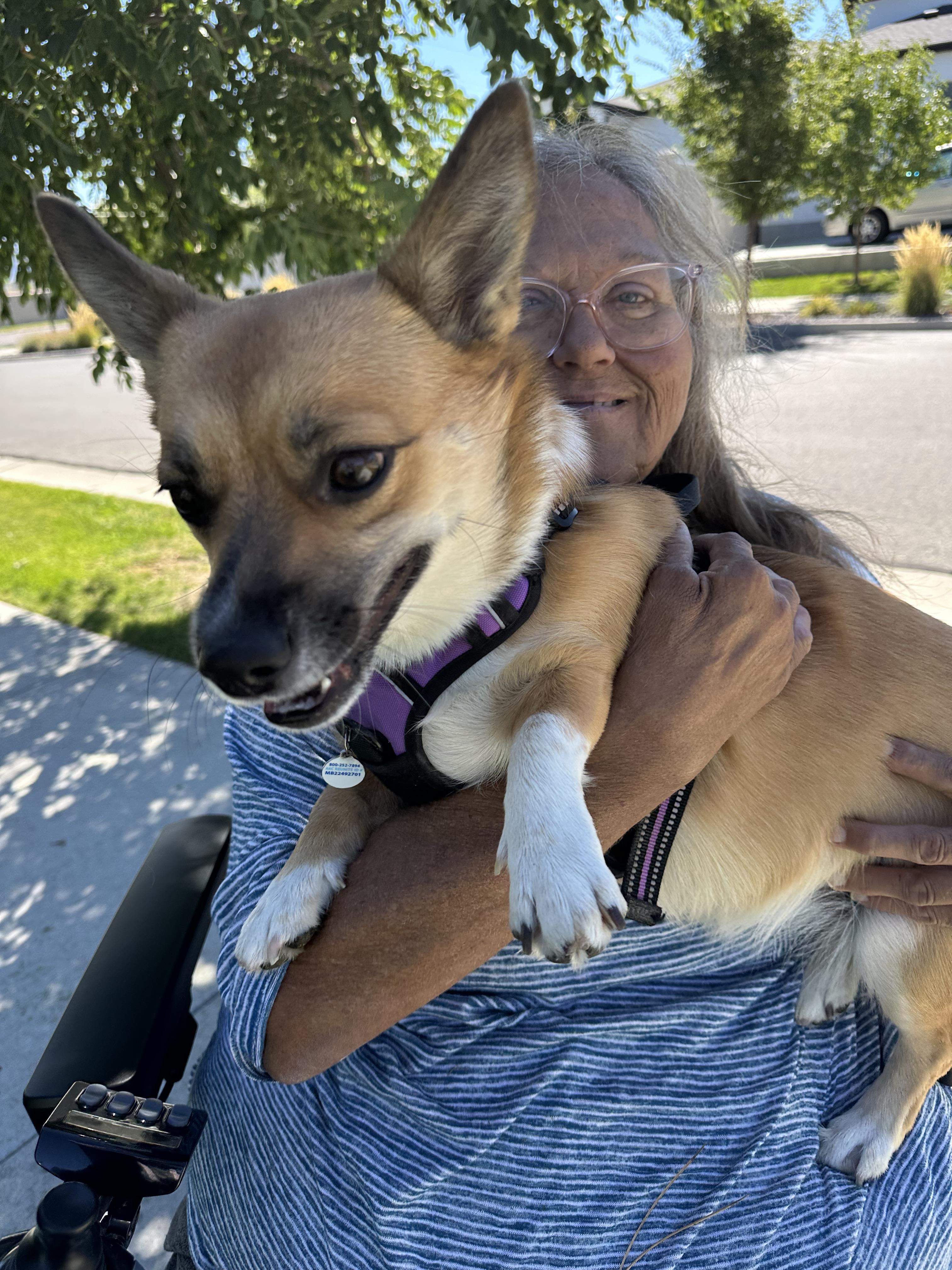 A woman holding a dog