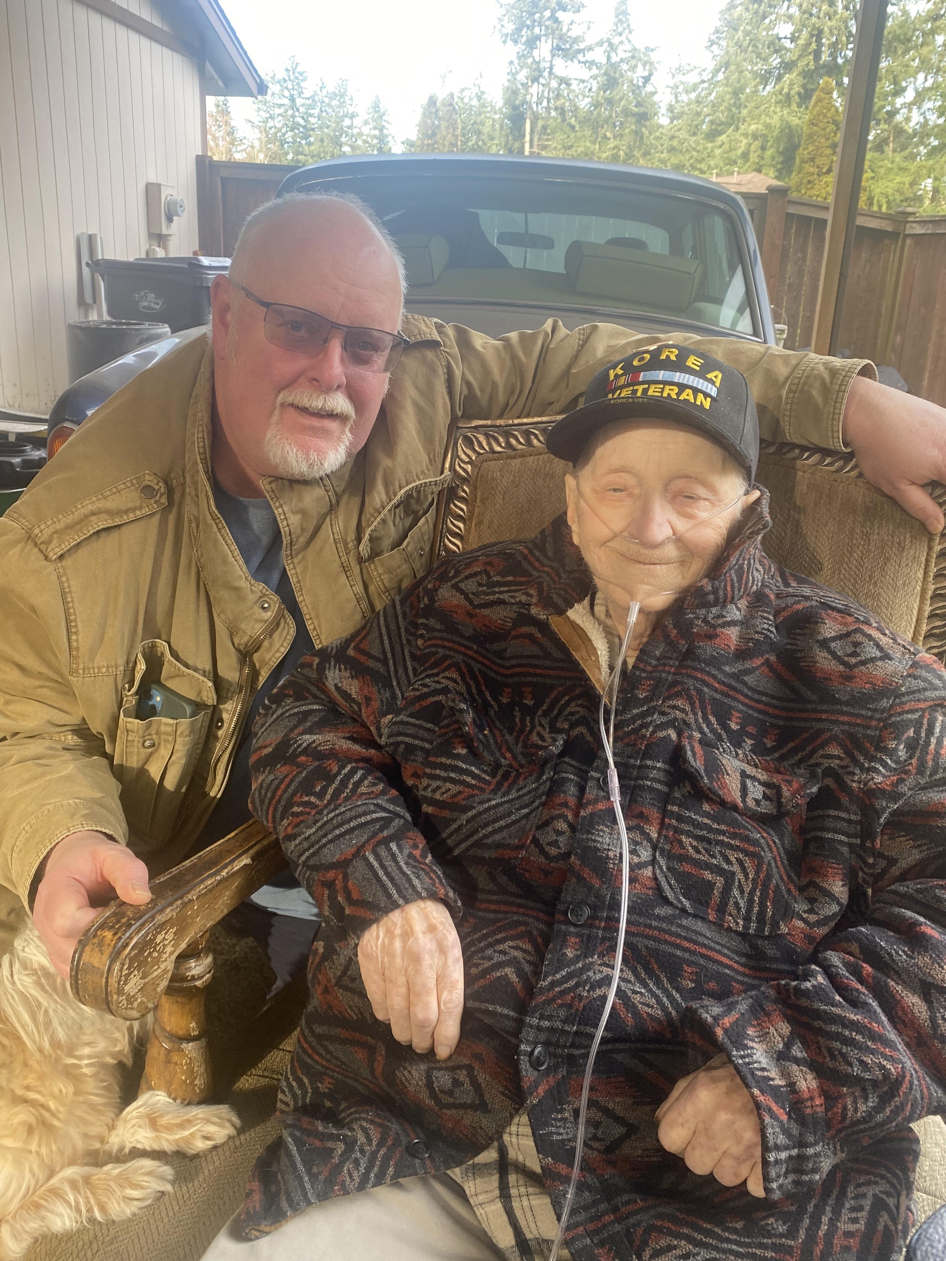 A man and woman sitting in a chair