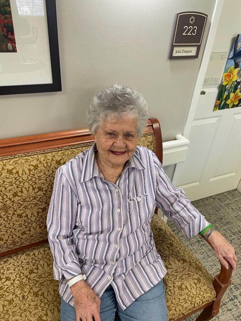An old woman sitting on a bench