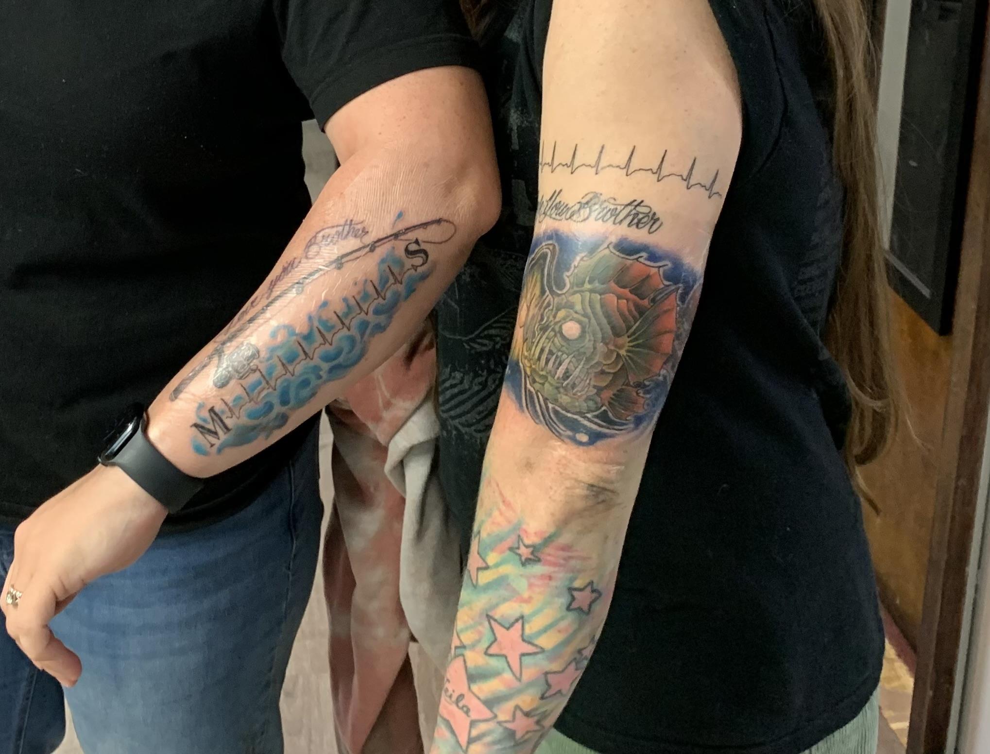A couple of people with tattoos