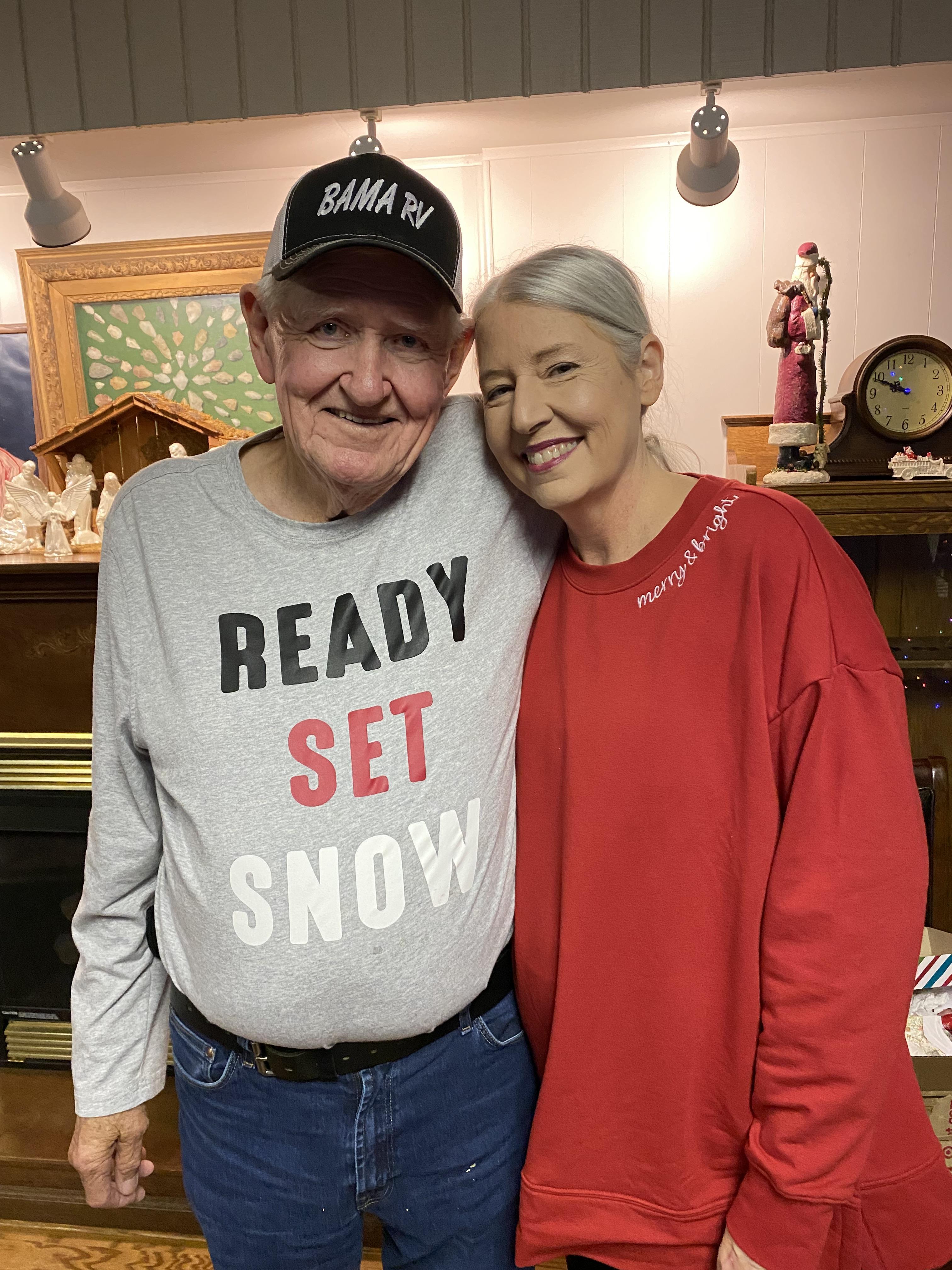A man and woman posing for a picture