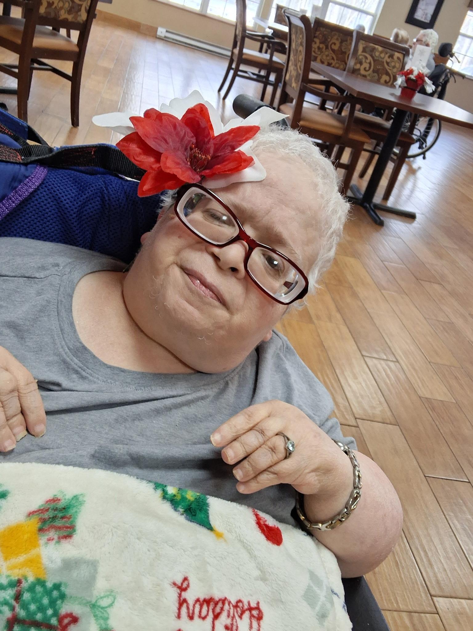 A woman with a flower on her head