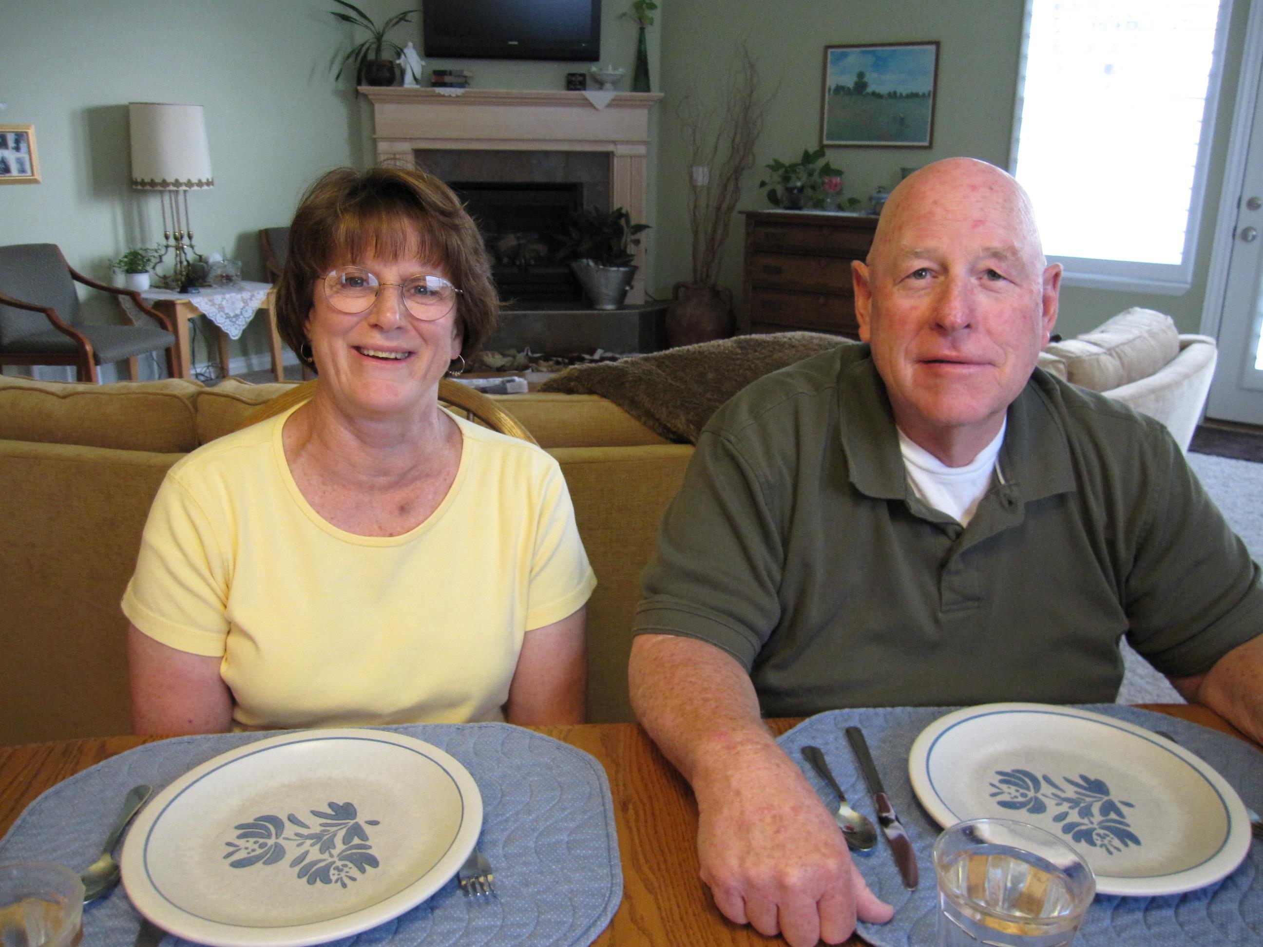 A man and woman sitting at a table