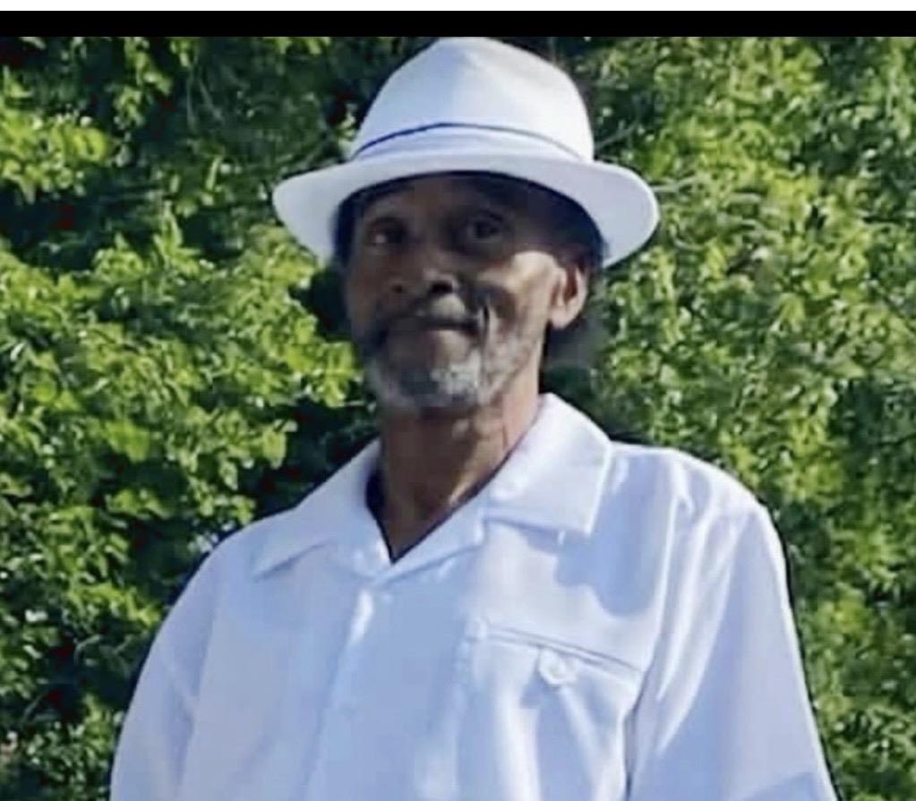 A man in a white shirt and hat