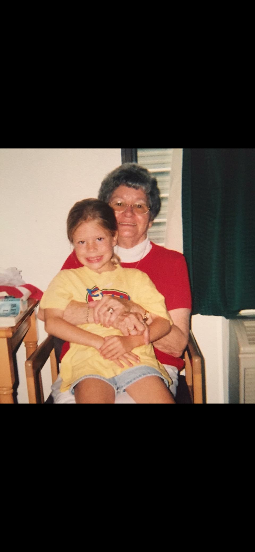 A woman holding a girl