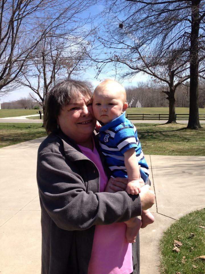 A woman holding a baby