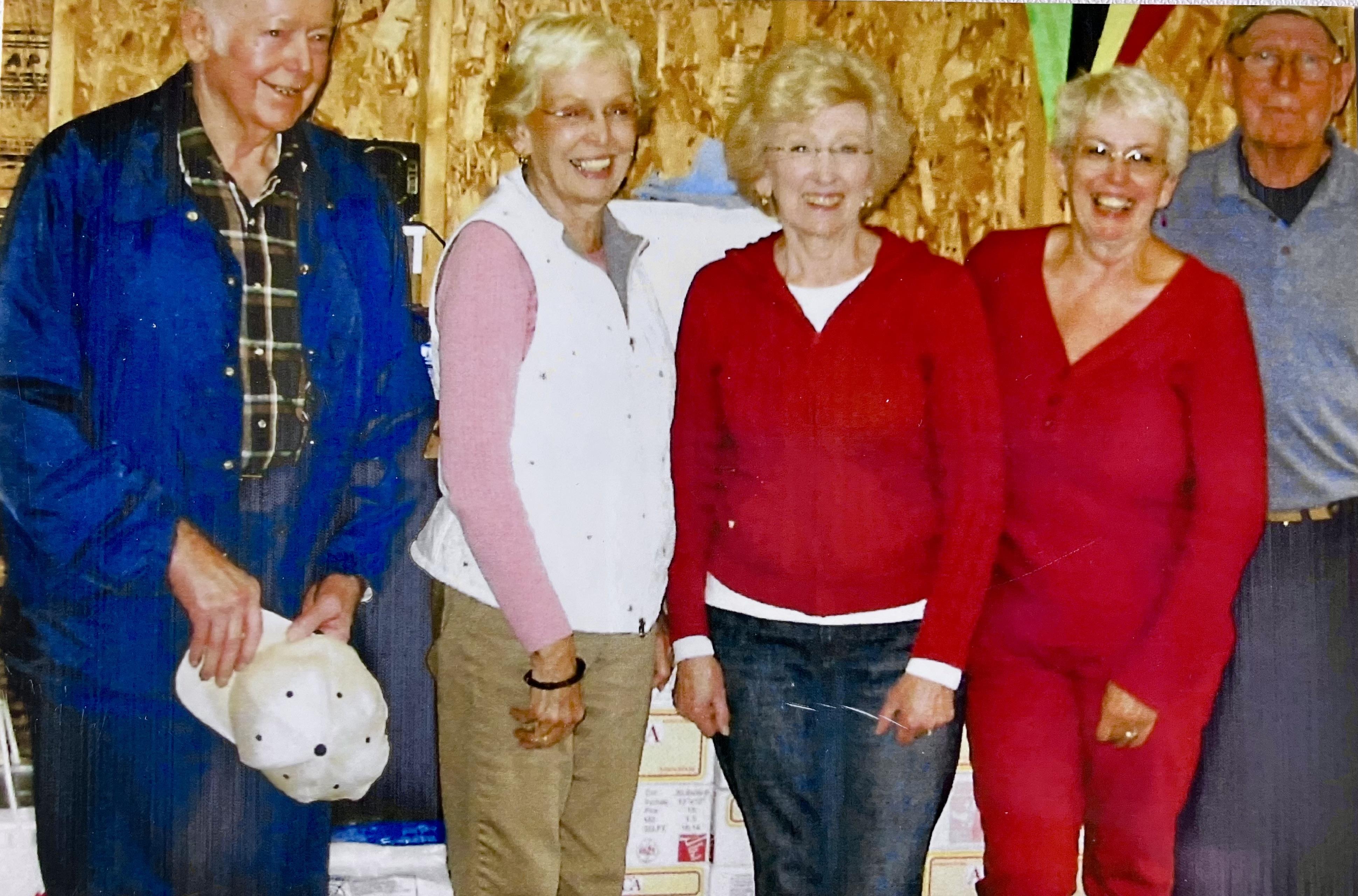 A group of old people posing for a photo
