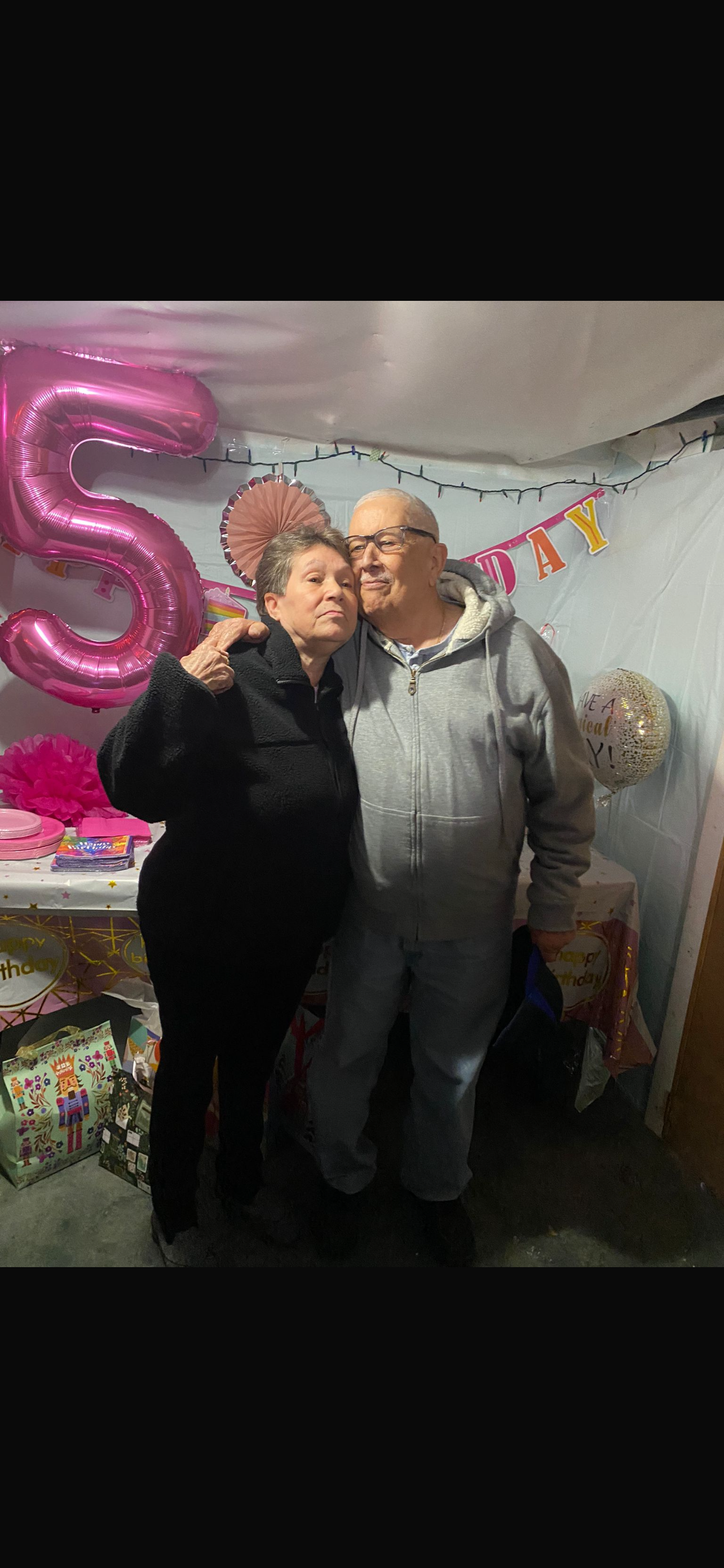 A man and woman posing for a picture