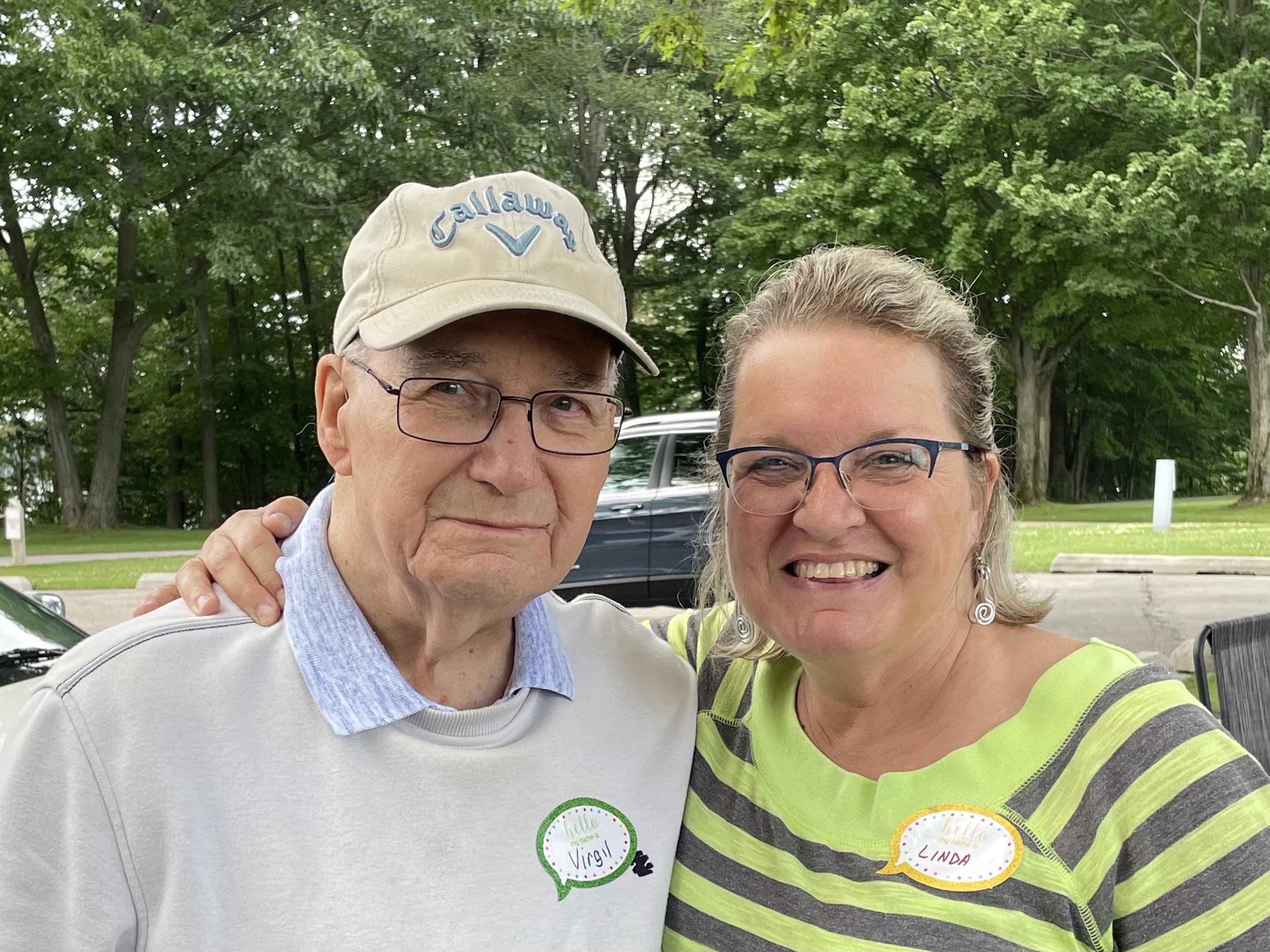 A man and woman posing for a picture