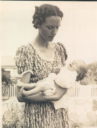 A woman holding a baby