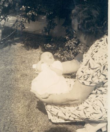 A woman holding a baby