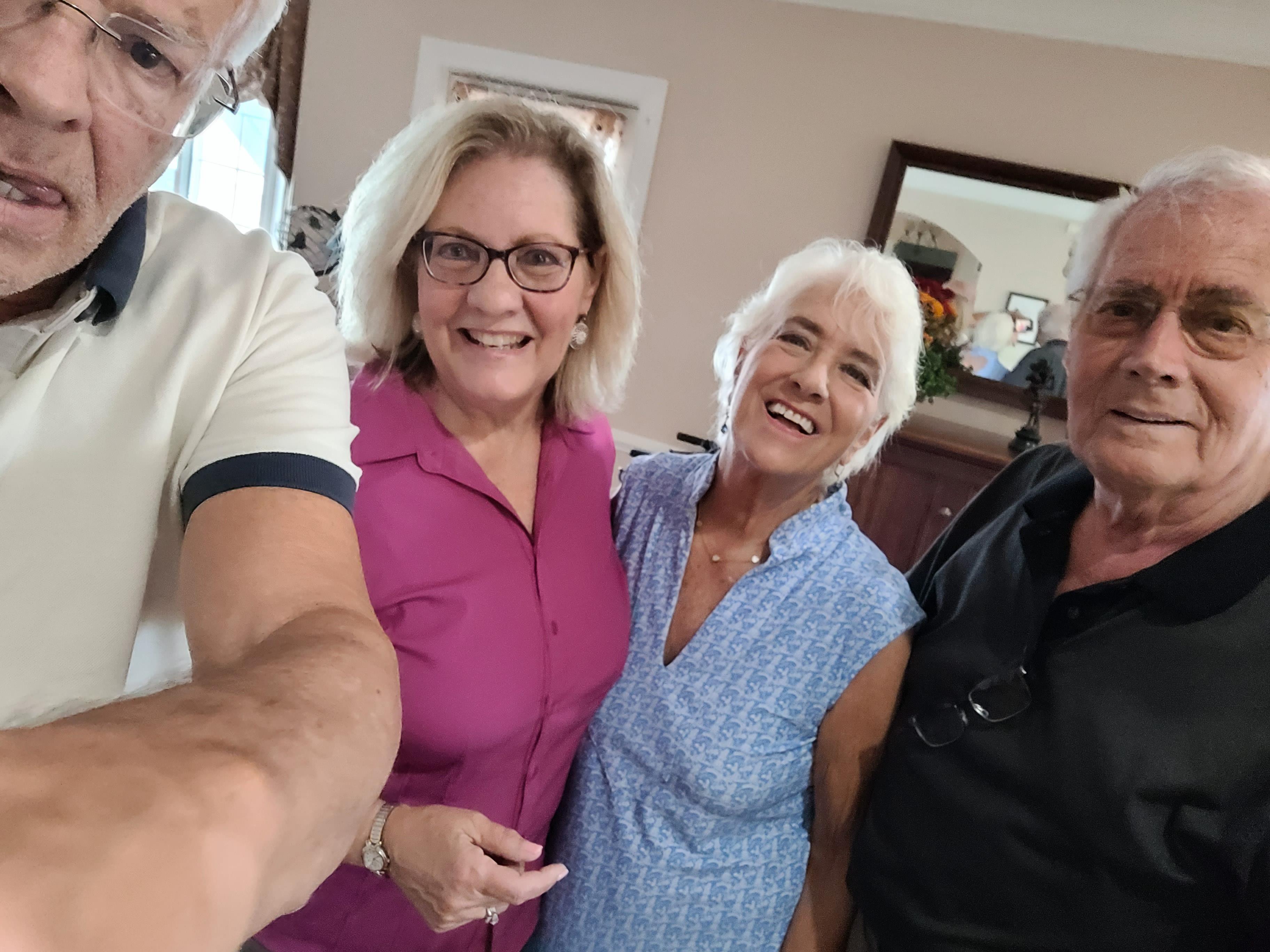 A group of people posing for a selfie