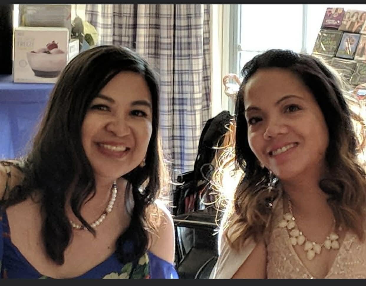 Two women smiling at the camera