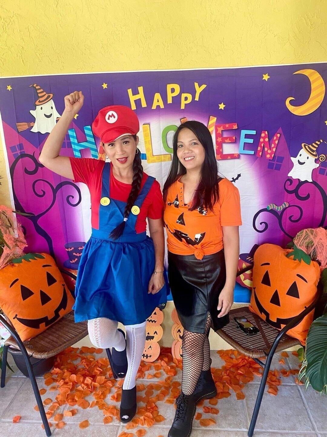 Two women in clothing posing for a picture