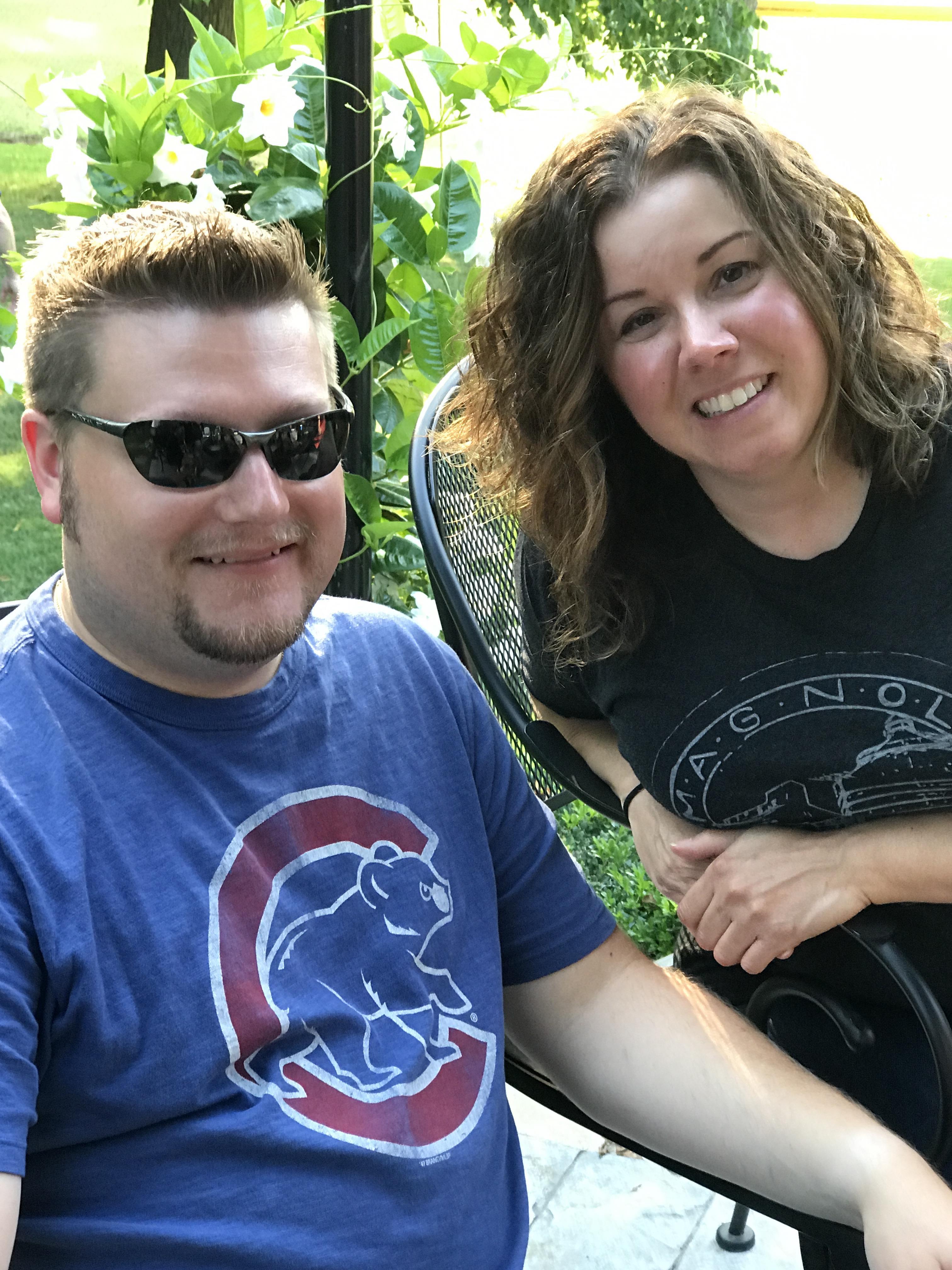 A man and woman sitting in a chair