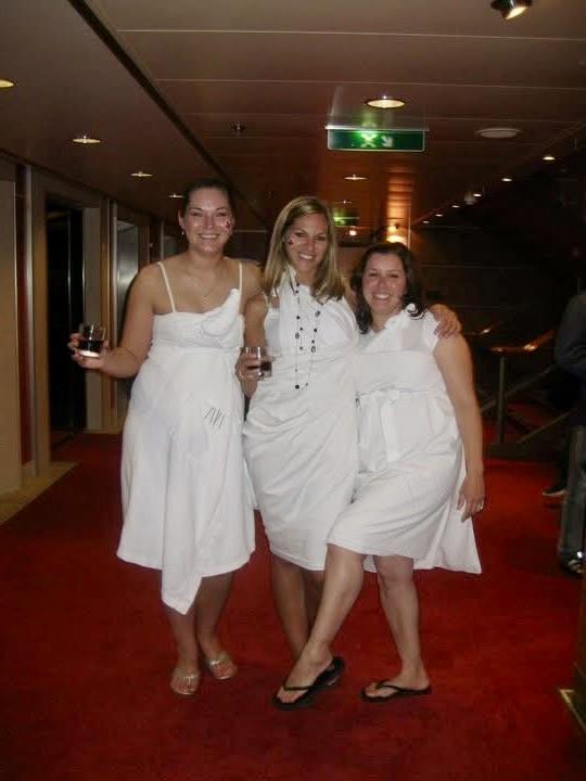 A group of women in white dresses