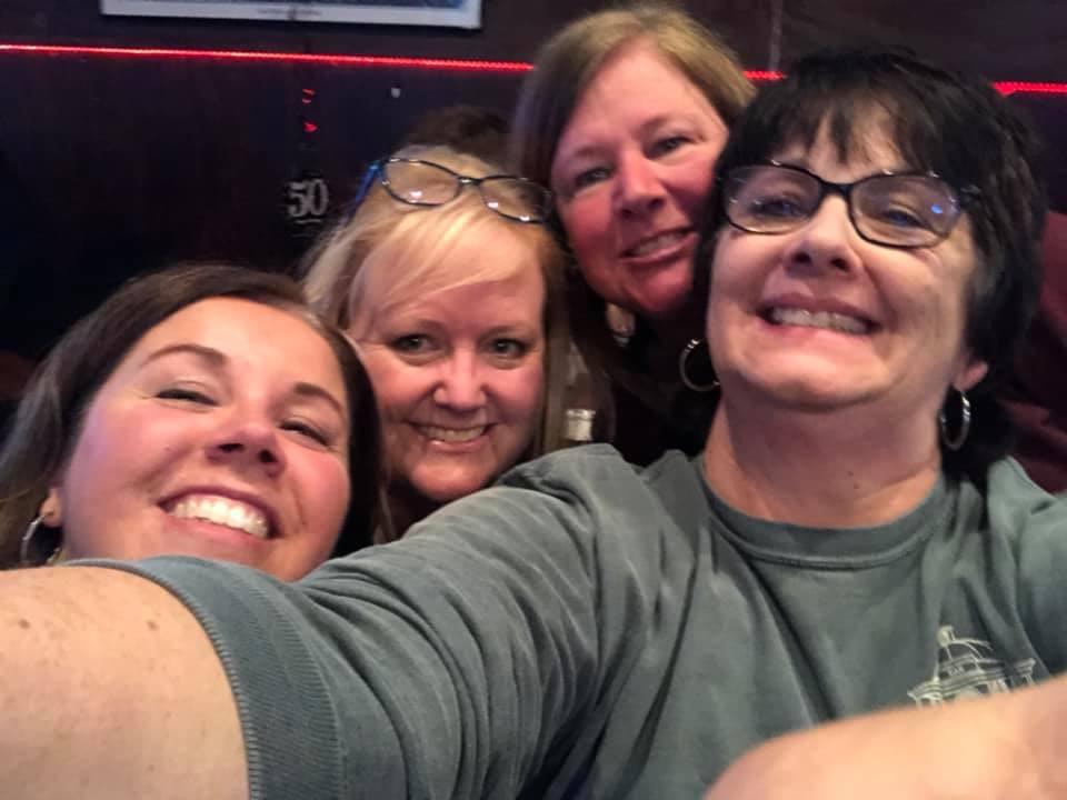 A group of women smiling for a selfie