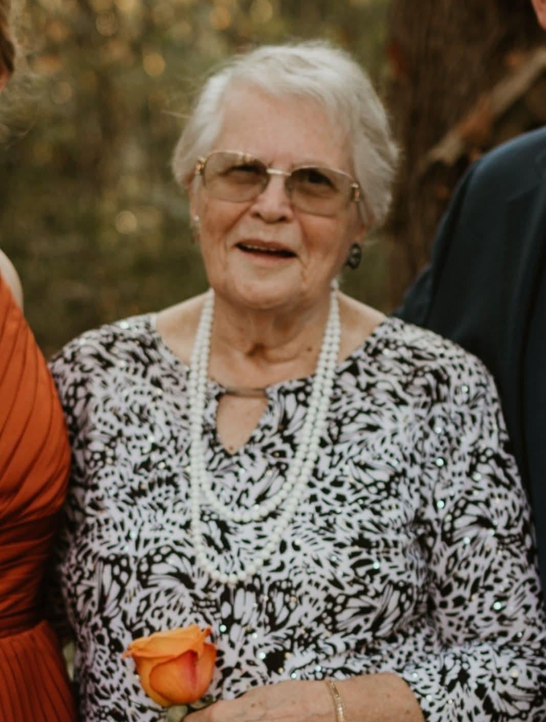 A woman wearing a pearl necklace